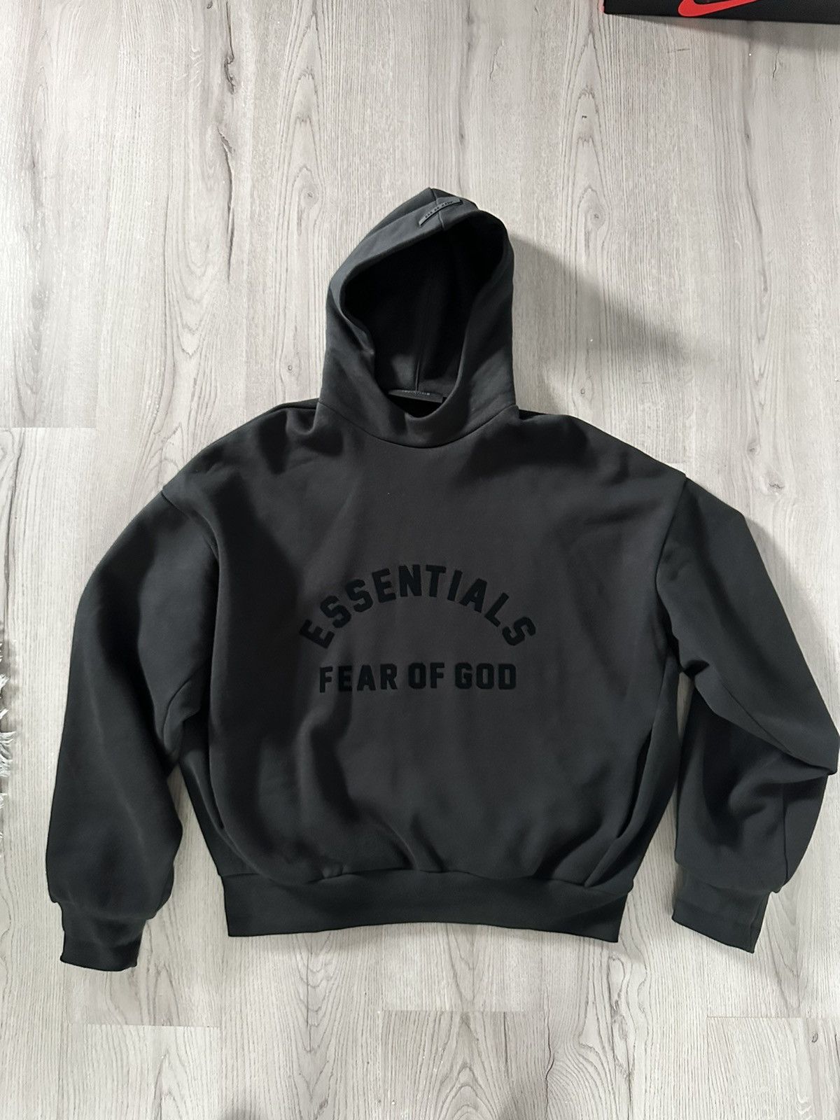 fear of god essentials jet black hoodie 2023