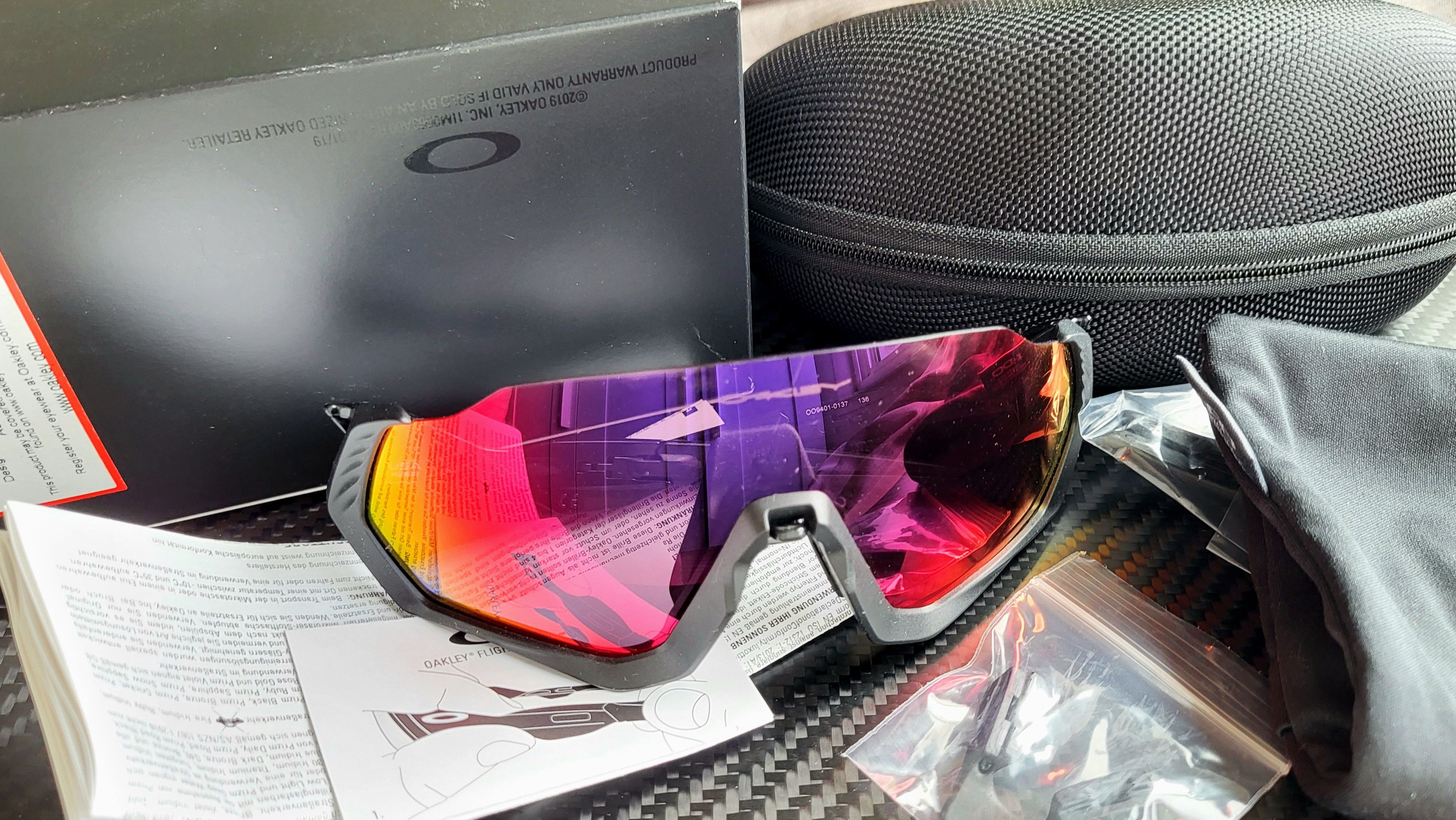 image of Oakley Flight Jacket Prism Color Red Purple Tint in Black, Men's