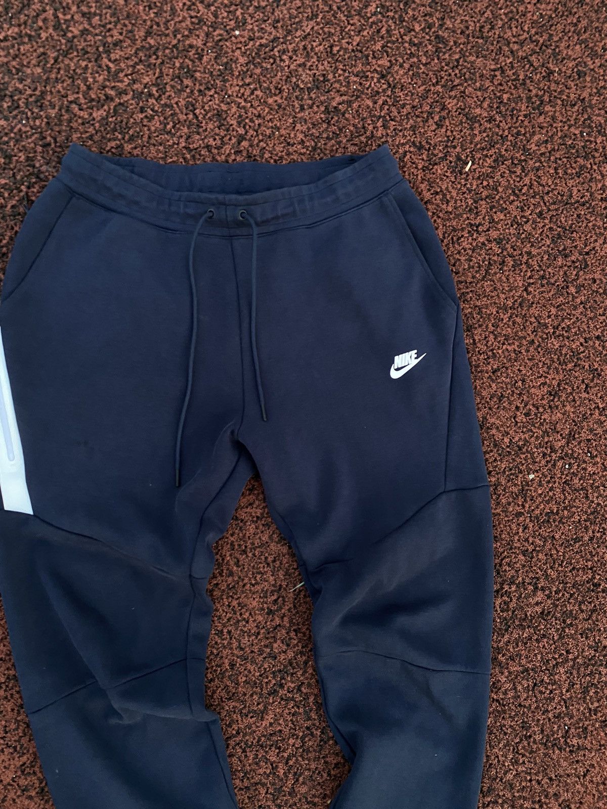 Navy blue nike tech pants deals