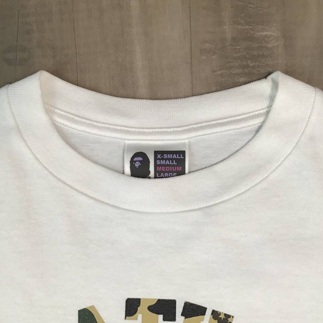 Bape × Kaws × Nigo KAWS × BAPE camo bendy NYC college logo T-shirt APE NIGO Size US M / EU 48-50 / 2 - 6 Thumbnail