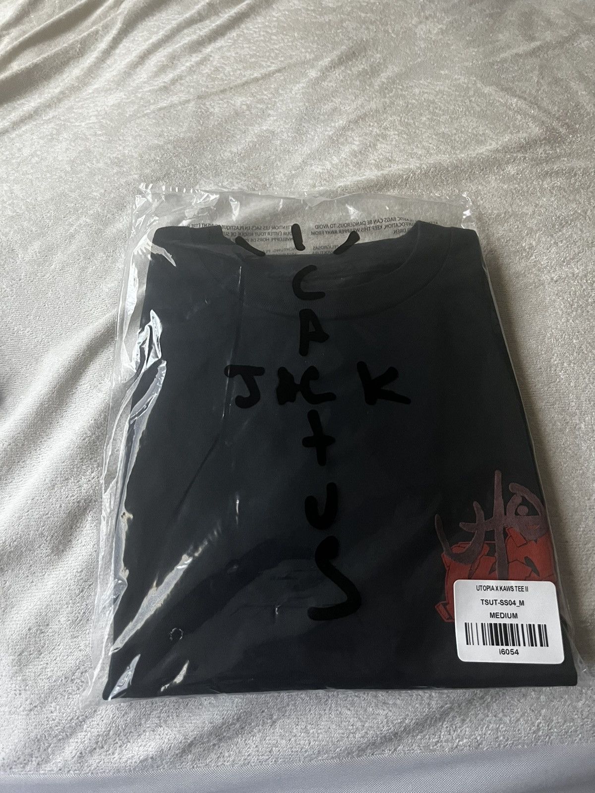 travis scott kaws shirt