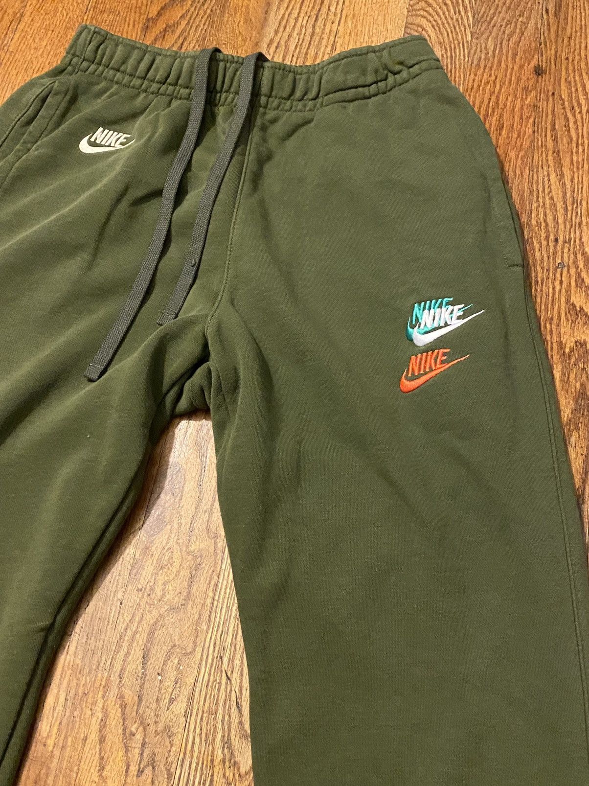 Nike Nike all over logo green jogger sweats Grailed