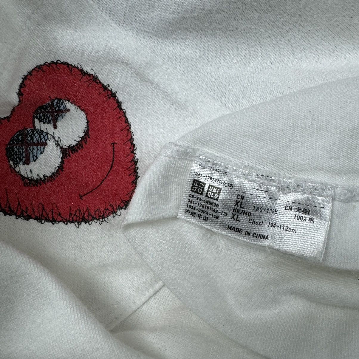 Kaws × Uniqlo ❄️Kaws x Uniqlo Red Heart Pocket T shirt Size US XL / EU 56 / 4 - 7 Thumbnail