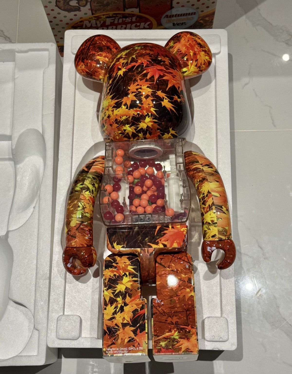 Medicom Toy Bearbrick My First Bearbrick Baby Autumn Leaves 1000% Size ONE SIZE - 2 Thumbnail
