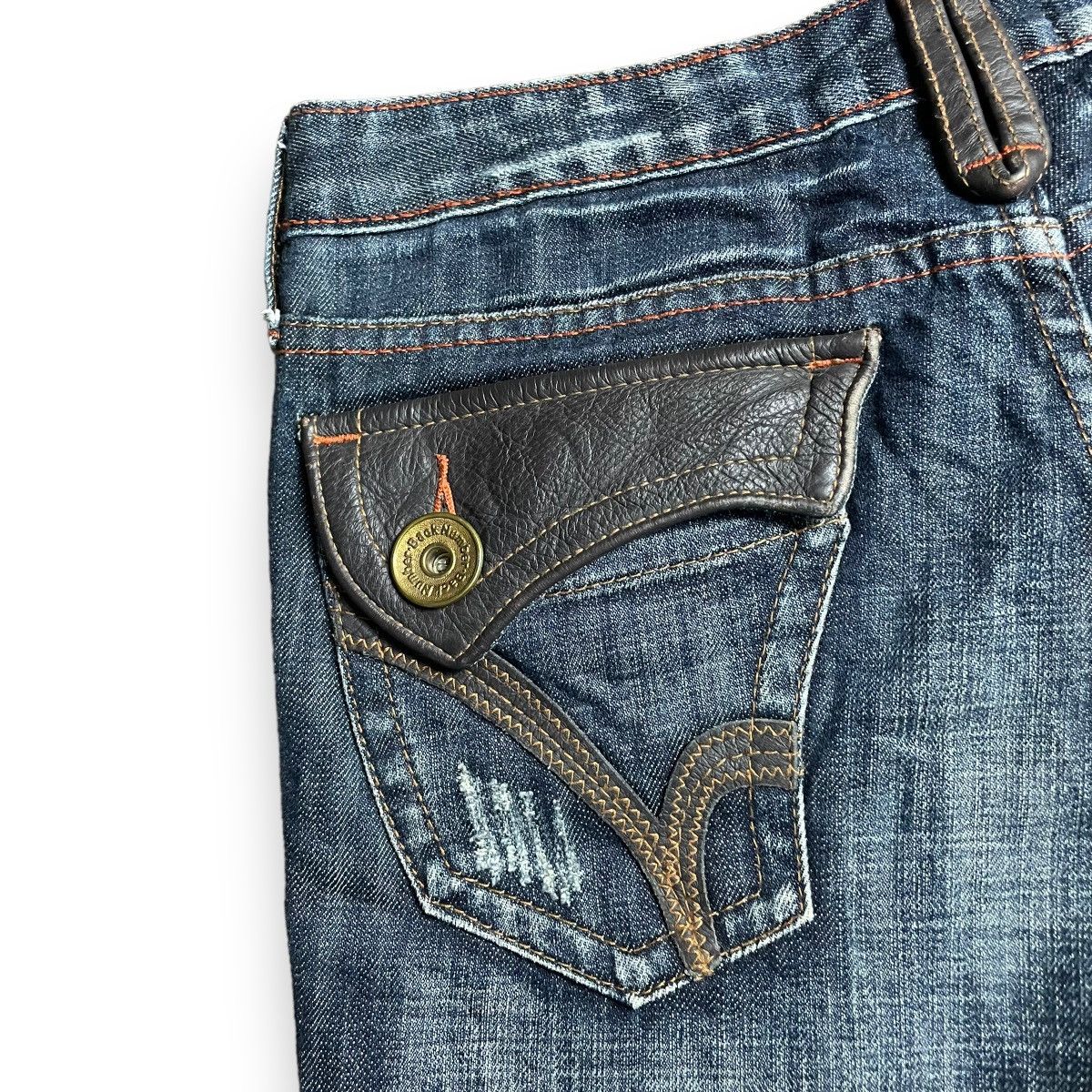 🇯🇵 SUPER FLARE BACK NUMBER LEATHER POCKET DENIM PANTS