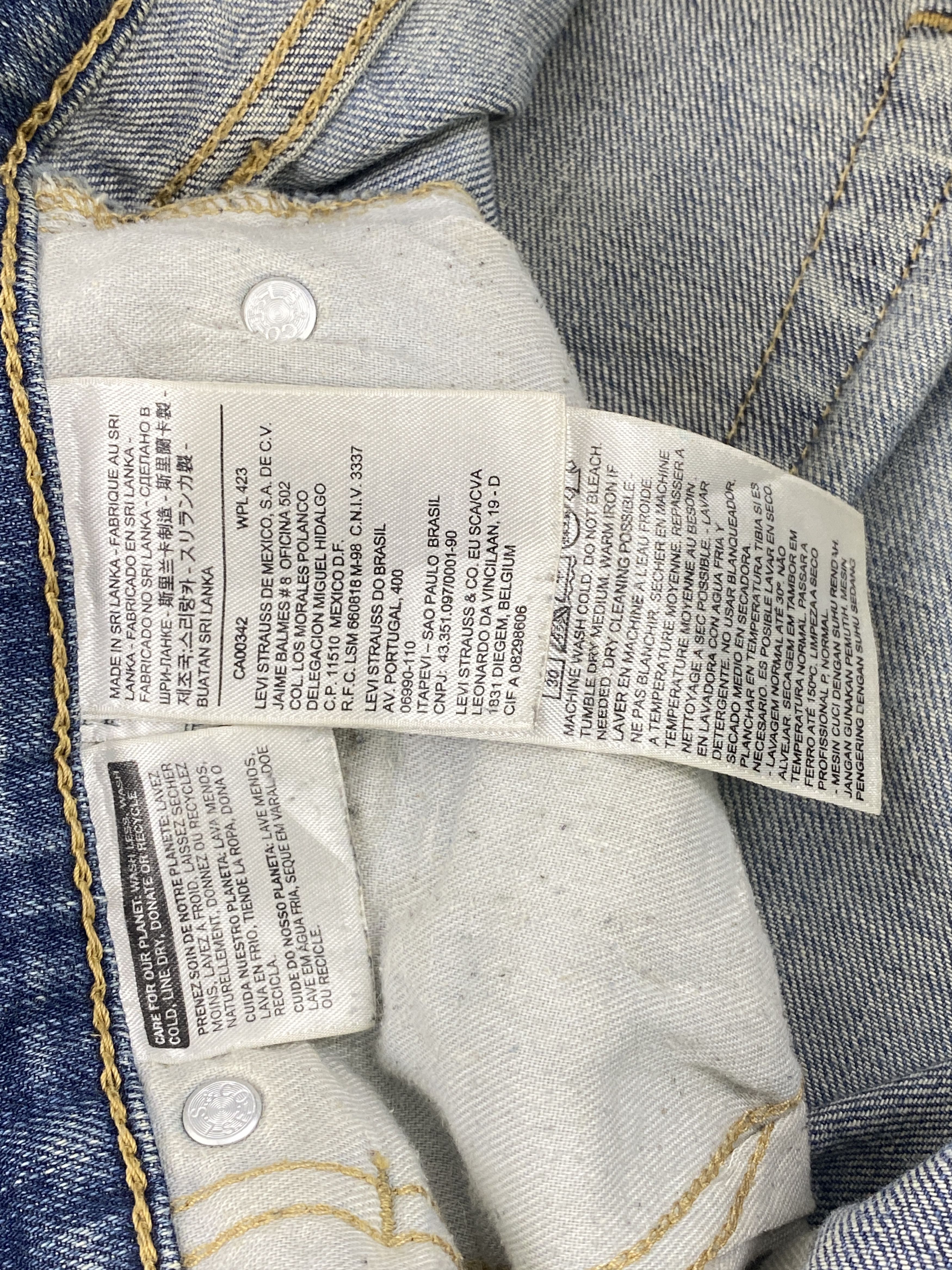 Distressed Vintage Levi's 514 Faded Blue Jeans