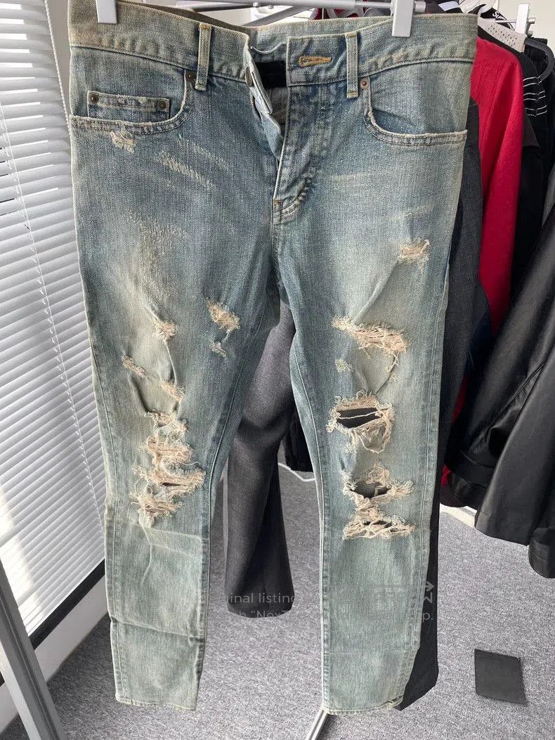 Saint Laurent Distressed Blue Denim Jeans.