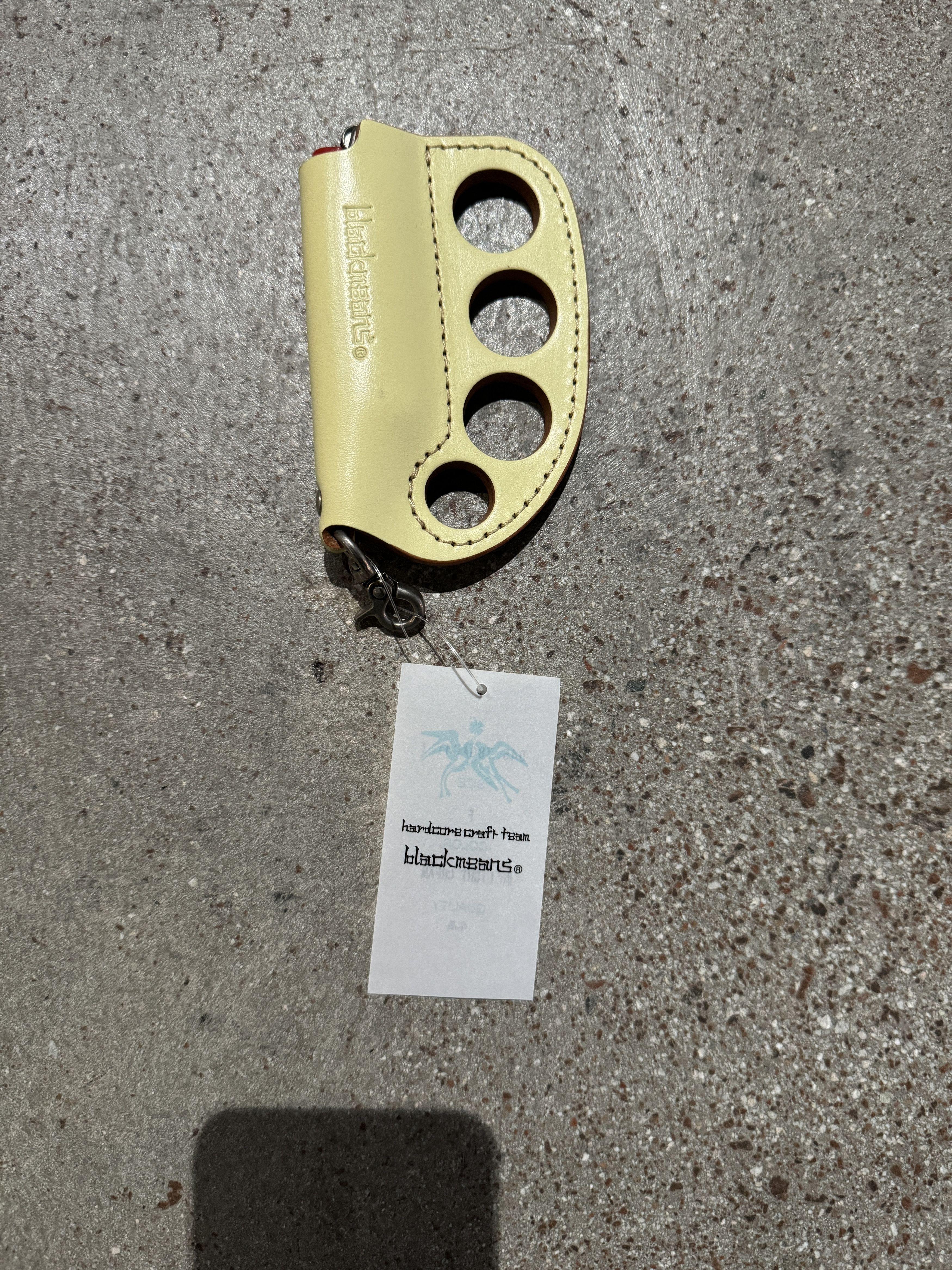 image of Blackmeans Knuckle Duster Lighter Holder Keychain in Mustard, Men's
