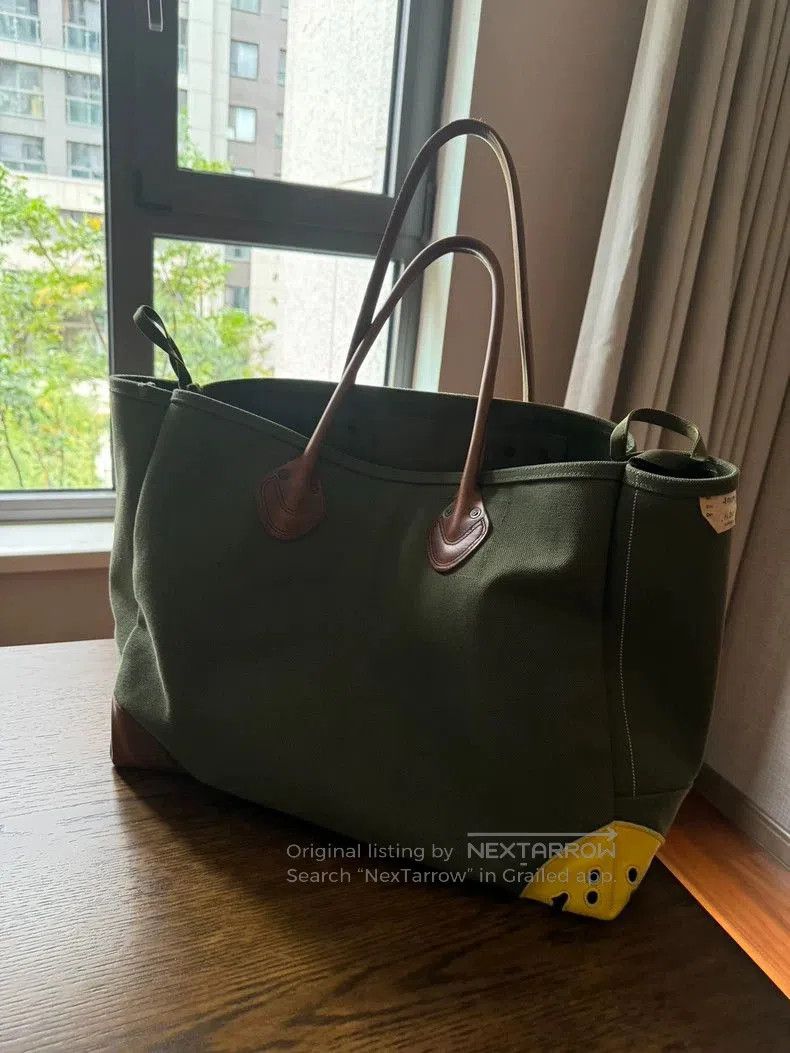 Kapital Canvas smiling face bag.