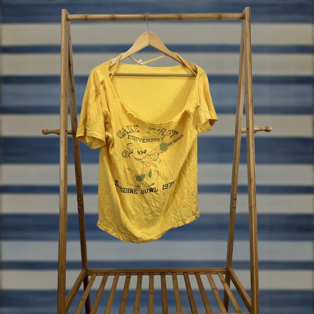 Disney VINTAGE Wake Forest University Disney Tangerine Bowl 1979 Thrashed Worn T-Shirt Mens L Yellow Shirt Distressed Mickey Disney Grunge 70s Size US L / EU 52-54 / 3 - 1 Thumbnail