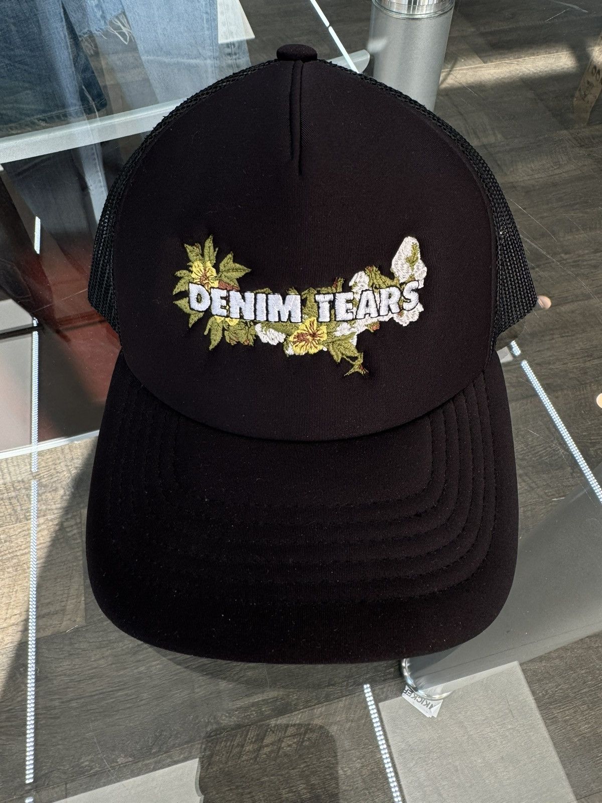 DENIM TEARS Cotton Wreath Logo Trucker Cap | Grailed