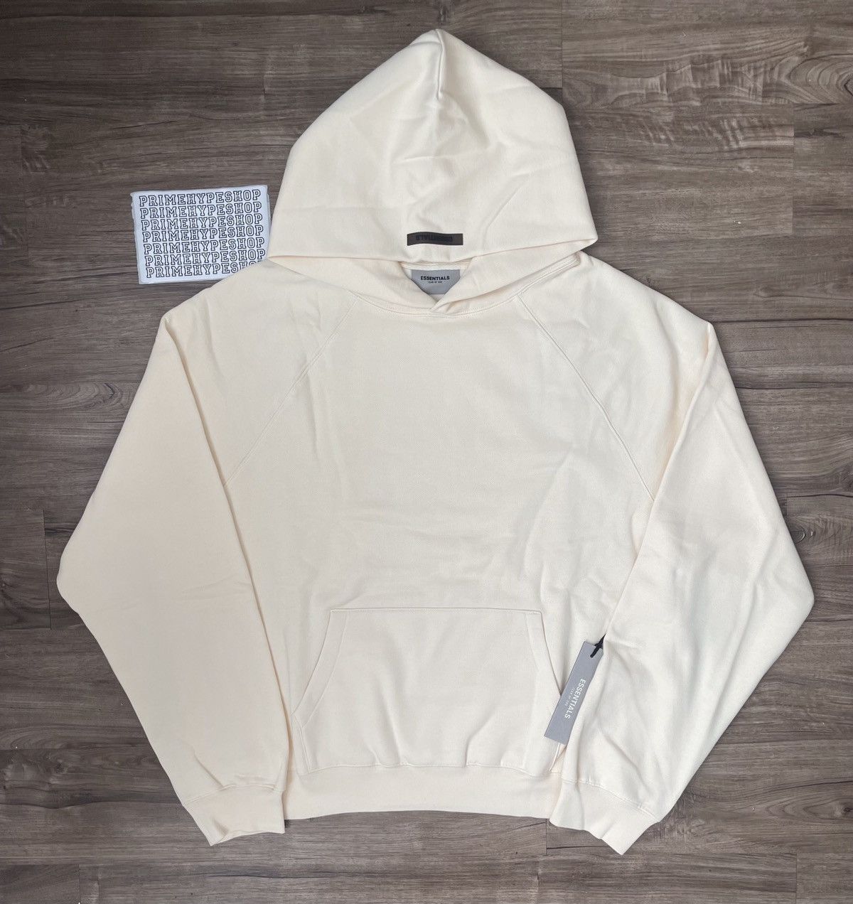 Fear of god essentials hoodie cream deals
