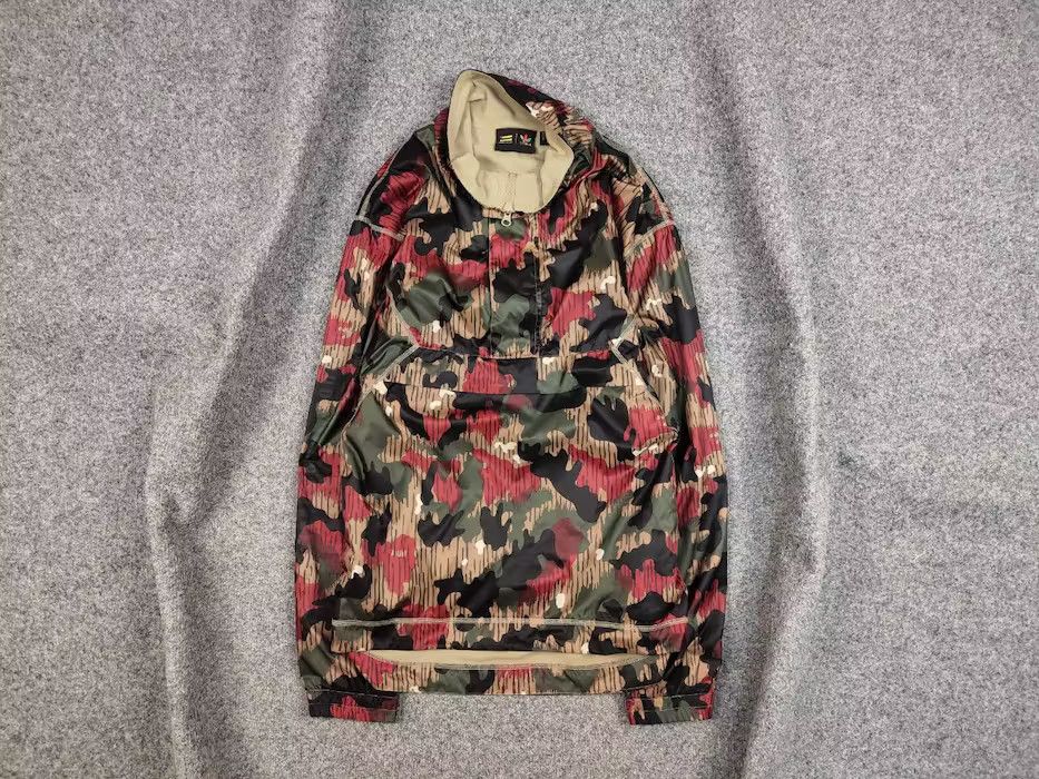 Adidas originals pharrell williams camo puffer jacket best sale