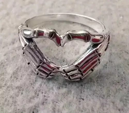 Jewelry Skull Hand With Heart-Shaped Ring Size ONE SIZE - 1 Thumbnail