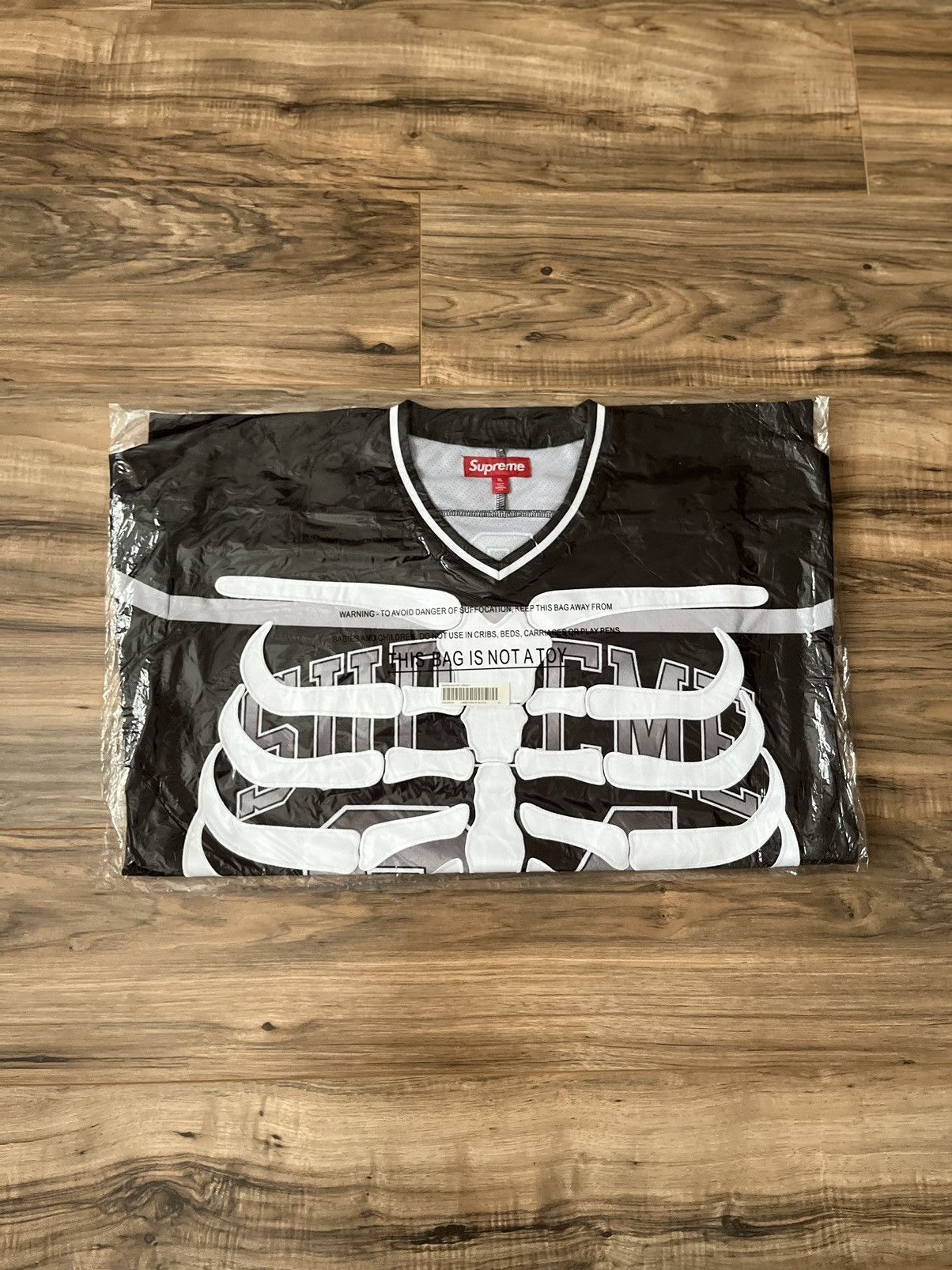 image of Supreme Bones Hockey Jersey in Black, Men's (Size XL)