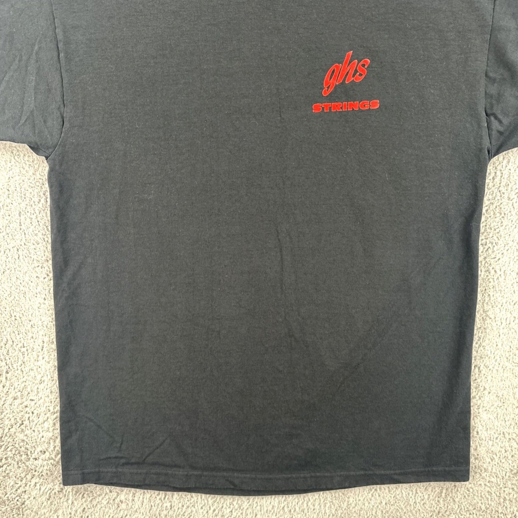 Vintage VINTAGE GHS STRINGS Boomers Guitar And Bass Strings Mens Large Black T Shirt 90s Size US L / EU 52-54 / 3 - 5 Thumbnail