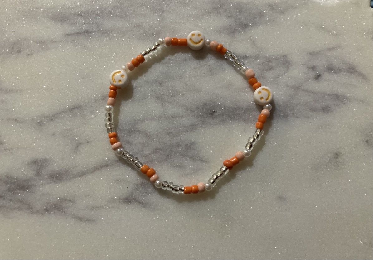 Other Orange smiley faced beaded bracelet Size ONE SIZE - 1 Preview