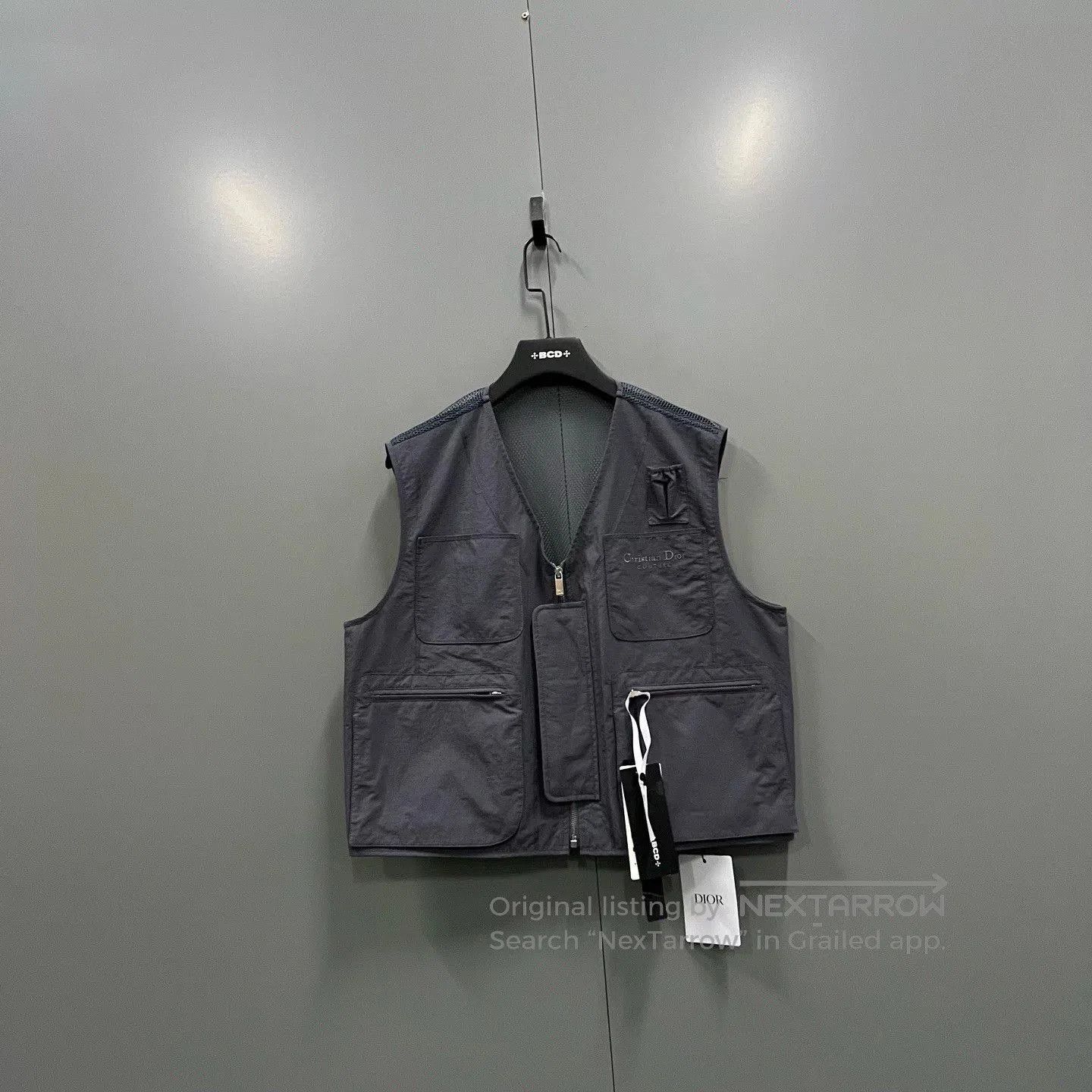 gray multi-pocket zip vest by Dior.