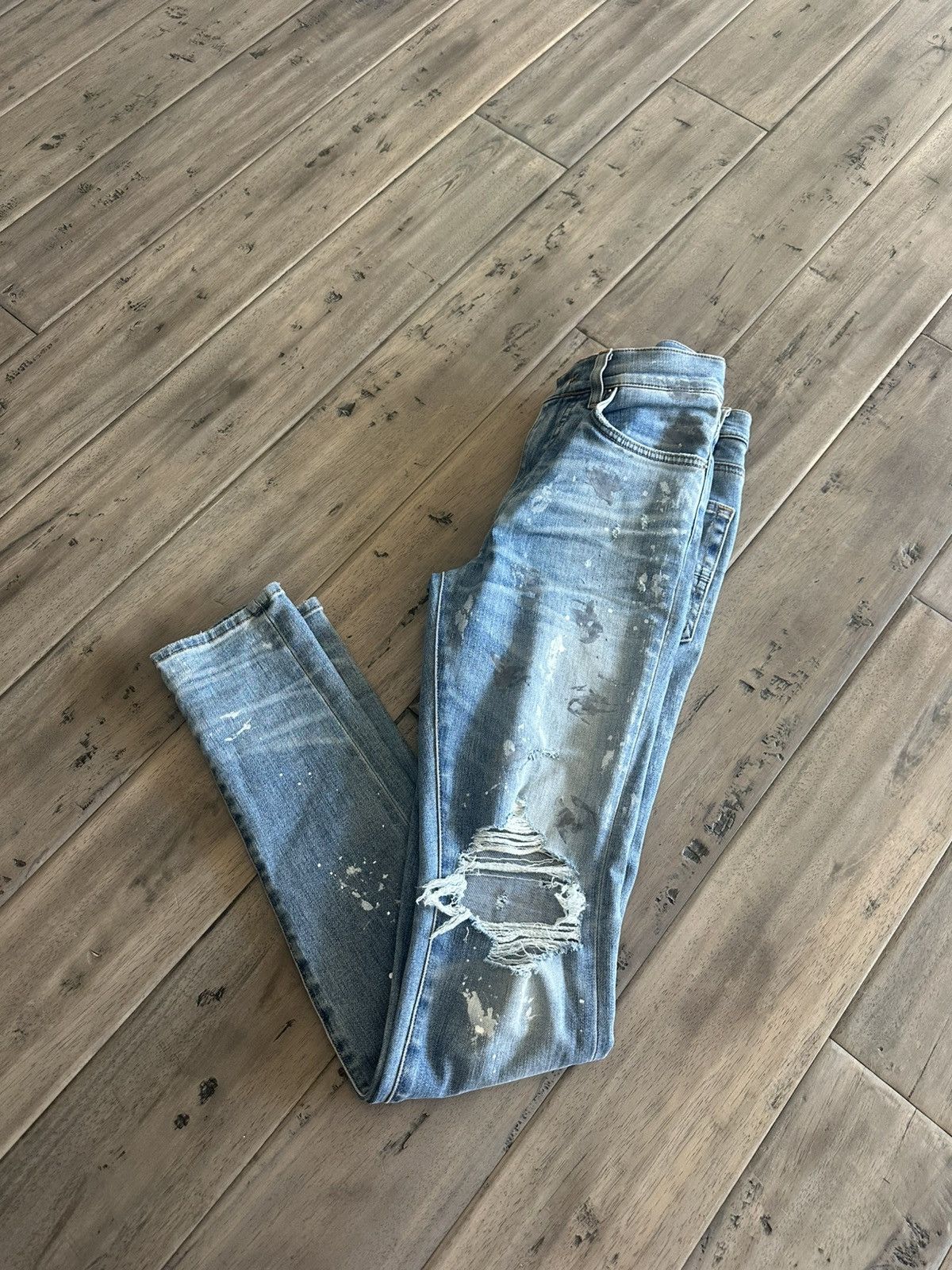 Amiri paint splatter skinny jeans