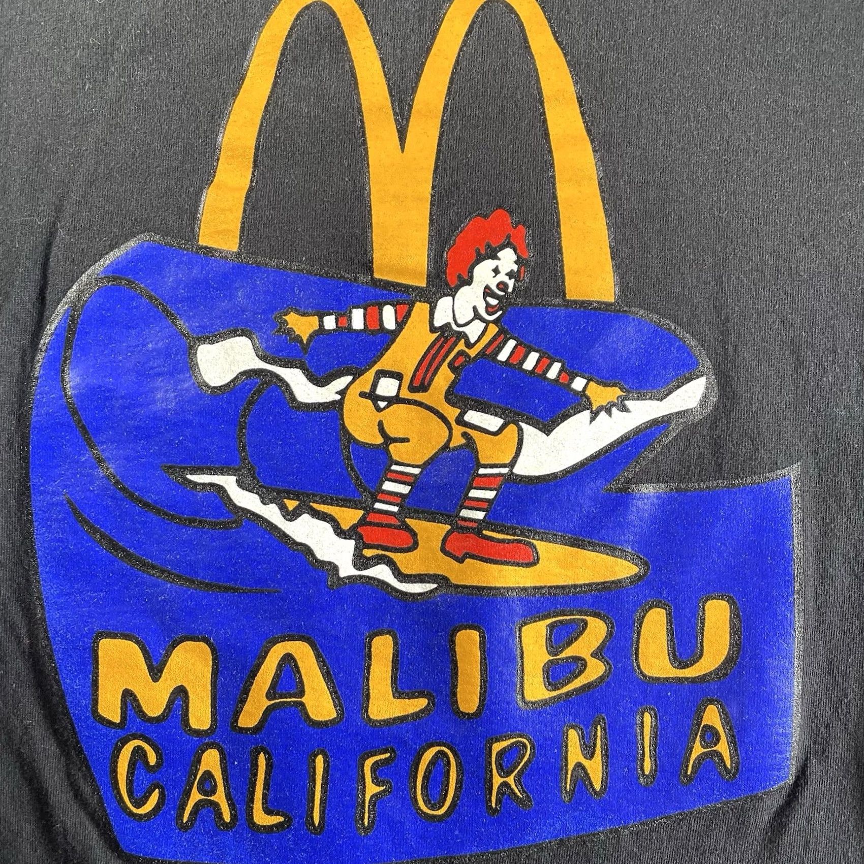 Champion Champion T-Shirt Men’s Large Black McDonald’s Malibu California Surf Ronald McDonald Tee Mens L California Surf Tee Size US L / EU 52-54 / 3 - 2 Thumbnail