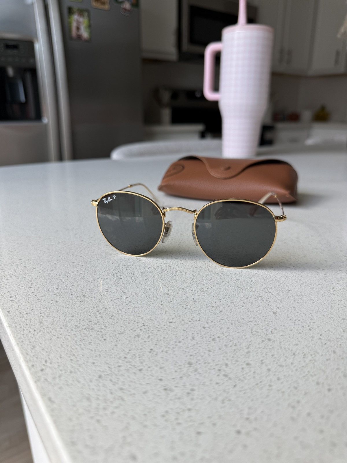 Gold and black ray-bans sunglasses