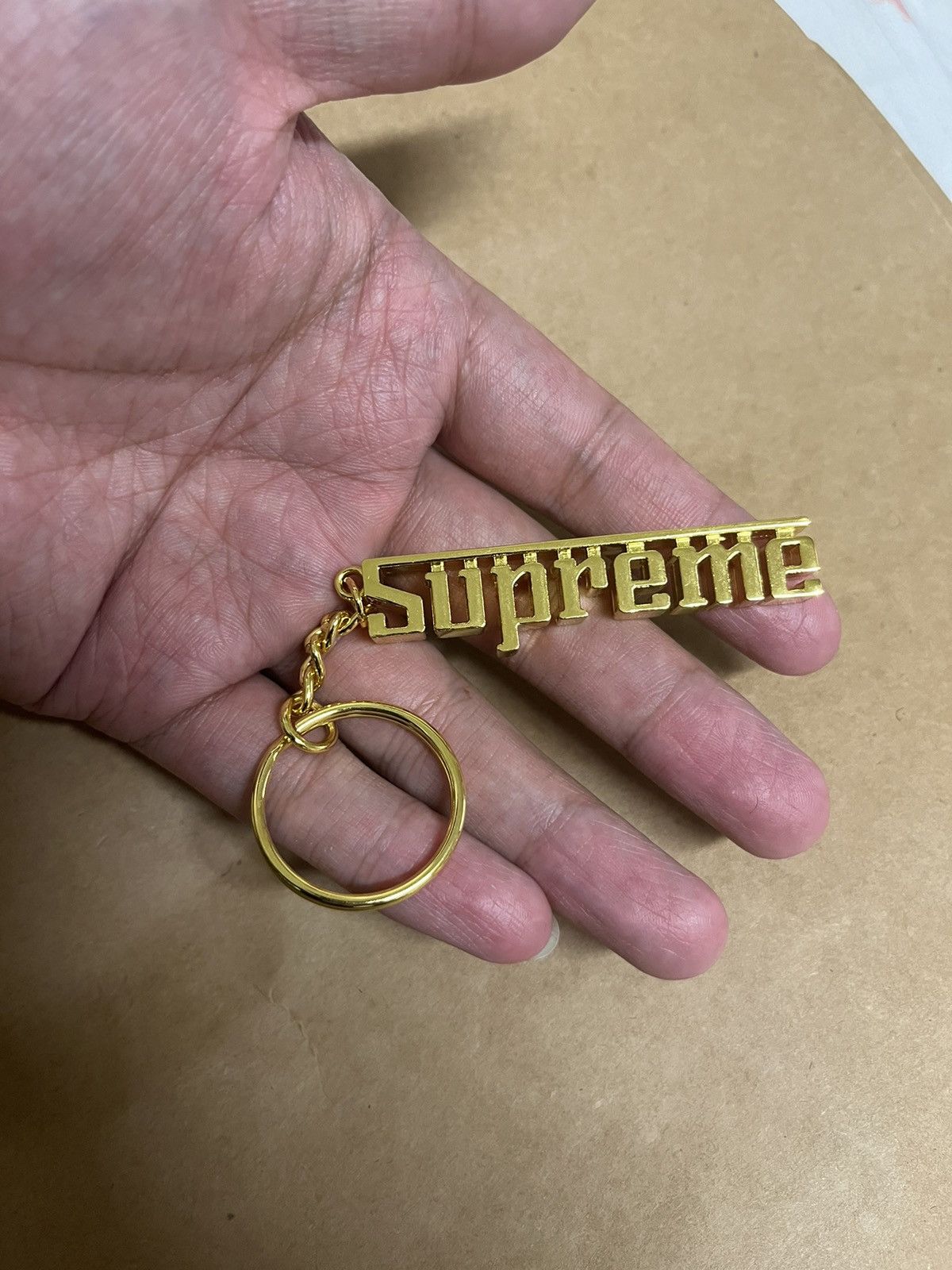 Supreme sales gold keychain