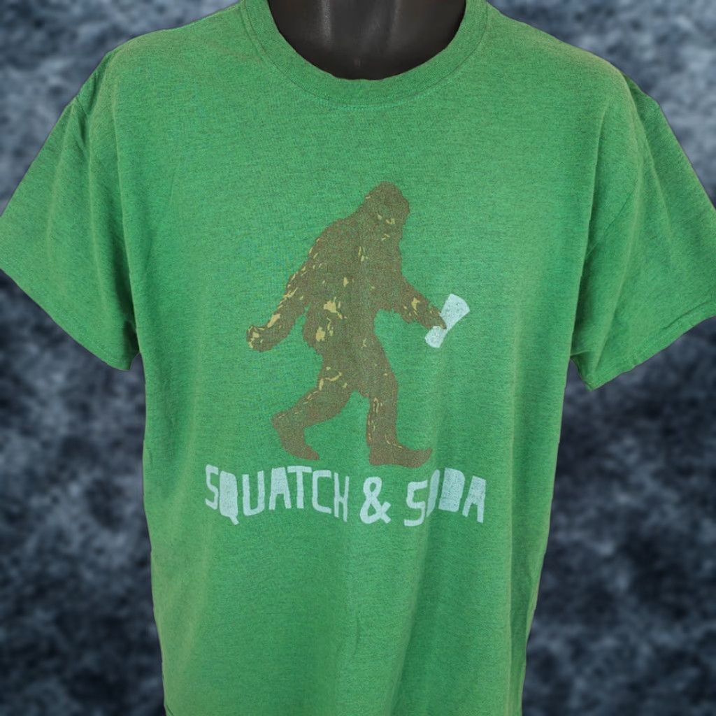 **Green Mens Large Squatch & Soda T-Shirt Funny Humor** User: **Green Mens Large Squatch & Soda T-Shirt Funny Humor**