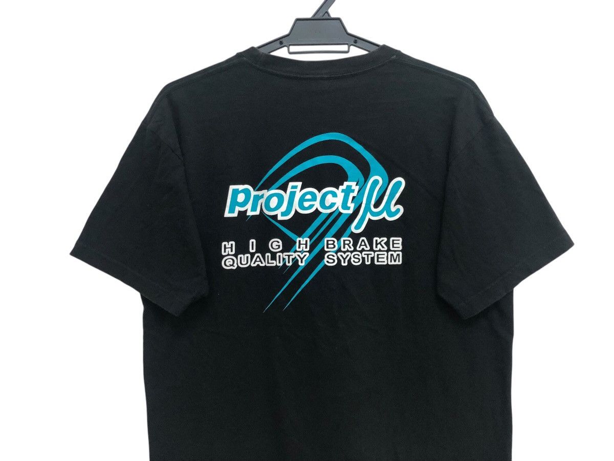Sports Specialties × Vintage RARE 🔥 PROJECT MU RACING PAD PROMO TEE JDM STYLE RARE Size US L / EU 52-54 / 3 - 7 Thumbnail