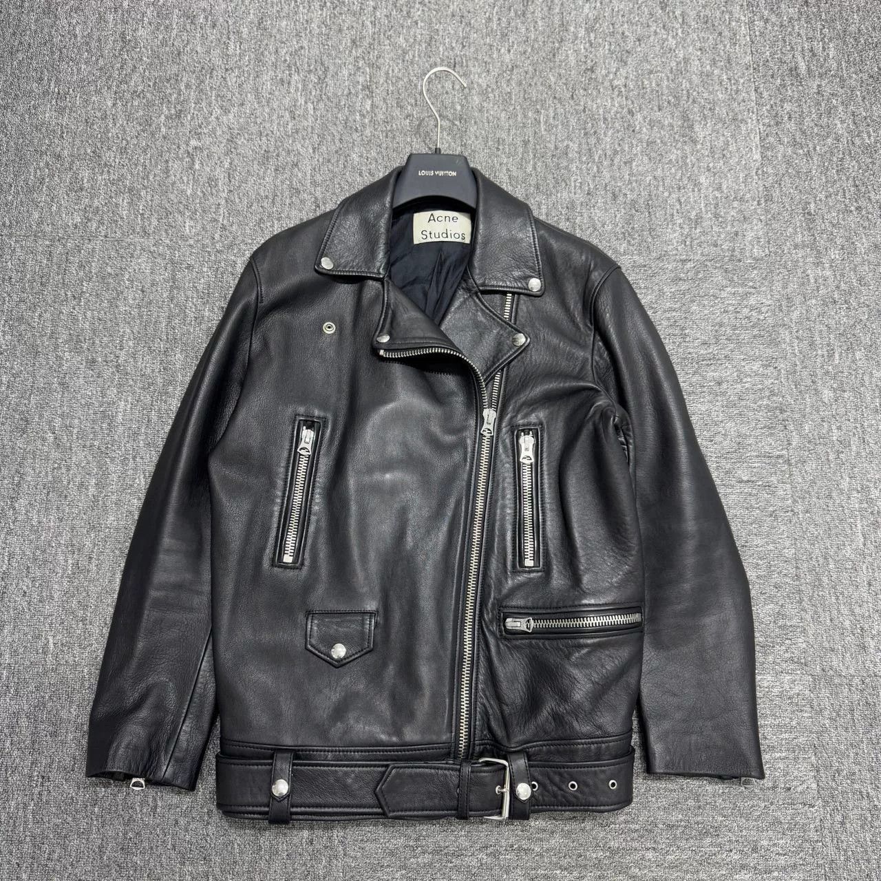 black leather biker jacket by Acne Studios.