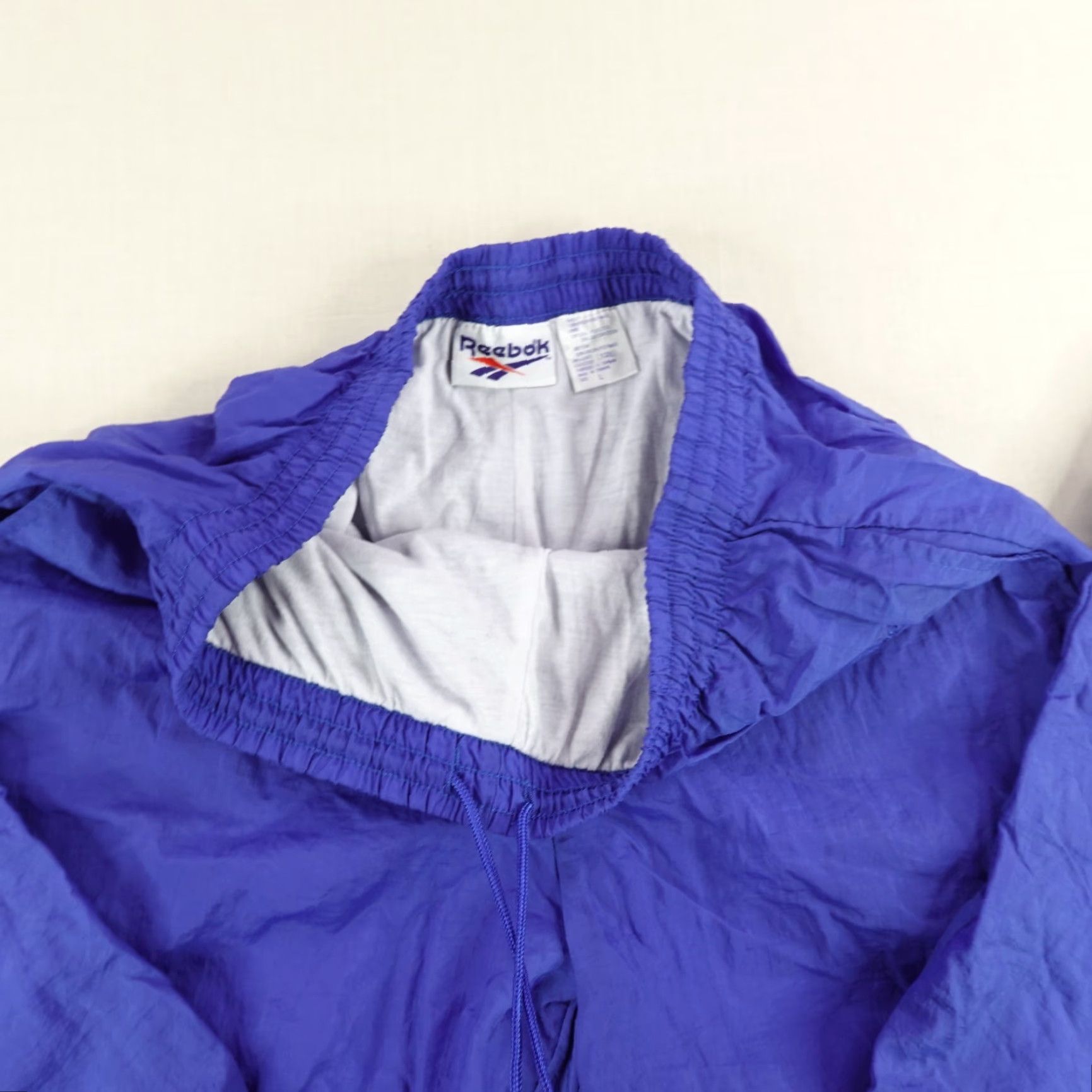 Reebok Vintage Reebok Pants Large Blue Windbreaker Track Pants Ankle Zip Lined 90s joggers ensemble? Size US 31 - 6 Thumbnail