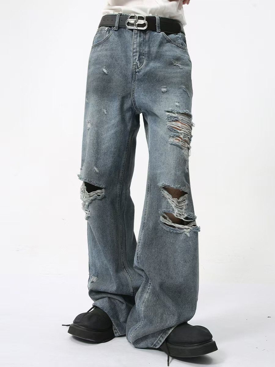 Washed and worn hip-hop ripped baggy jeans
