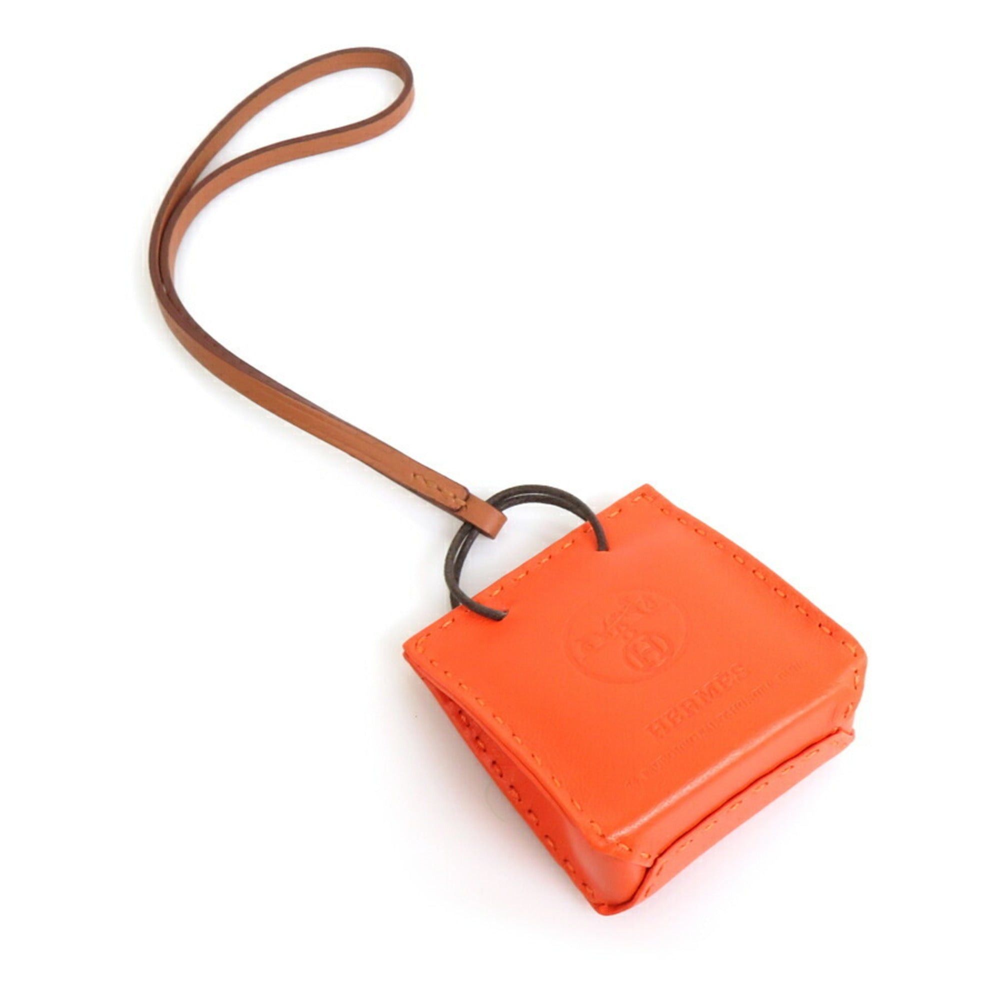 image of Hermes Charm Sack Orange Leather Orange/brown Unisex in Black, Women's