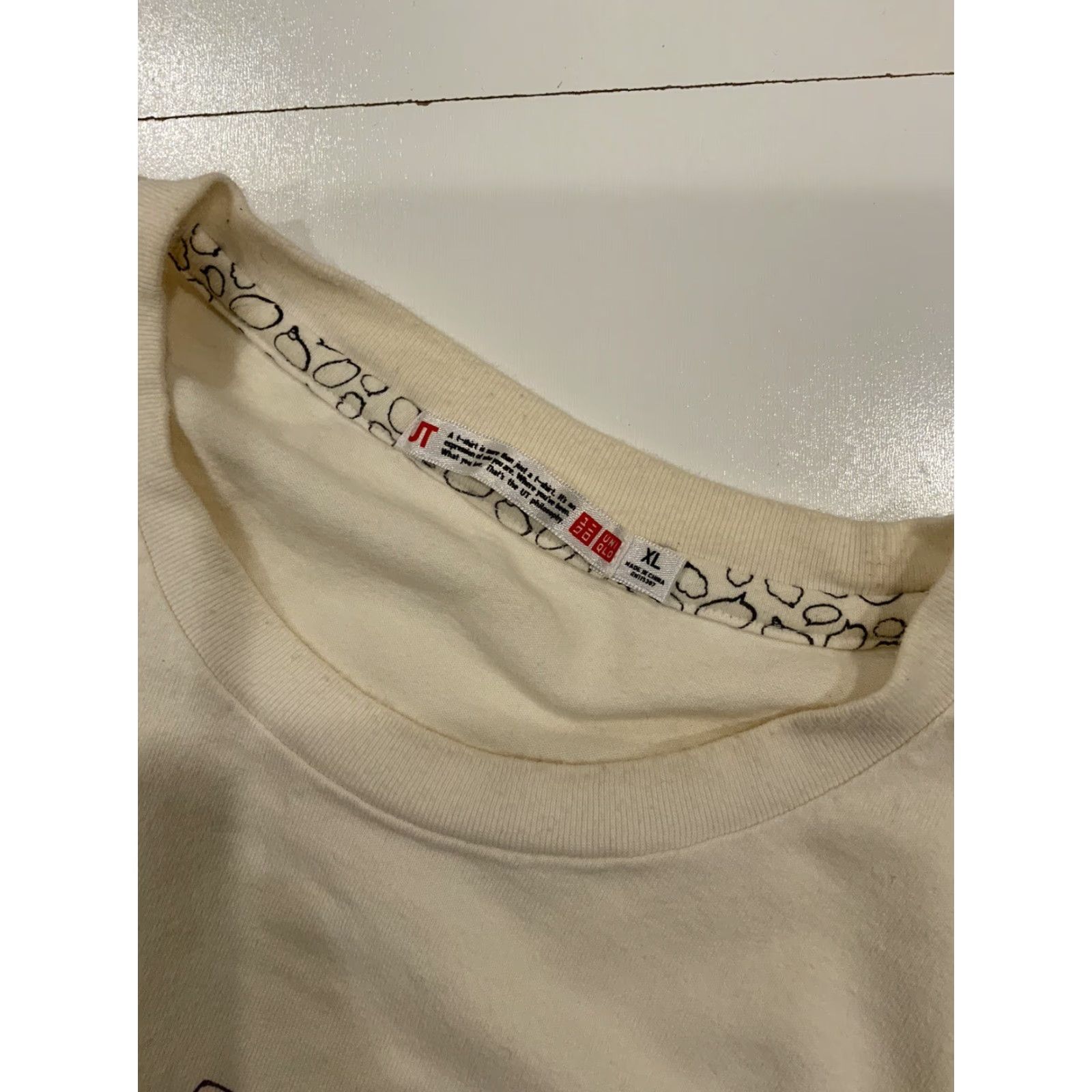 Uniqlo **UT Uniqlo Monsters Characters Crowd Scene Graphic White T-Shirt XL** User: **UT Uniqlo Monsters Characters Crowd Scene Graphic White T-Shirt XL** Size US XL / EU 56 / 4 - 6 Thumbnail