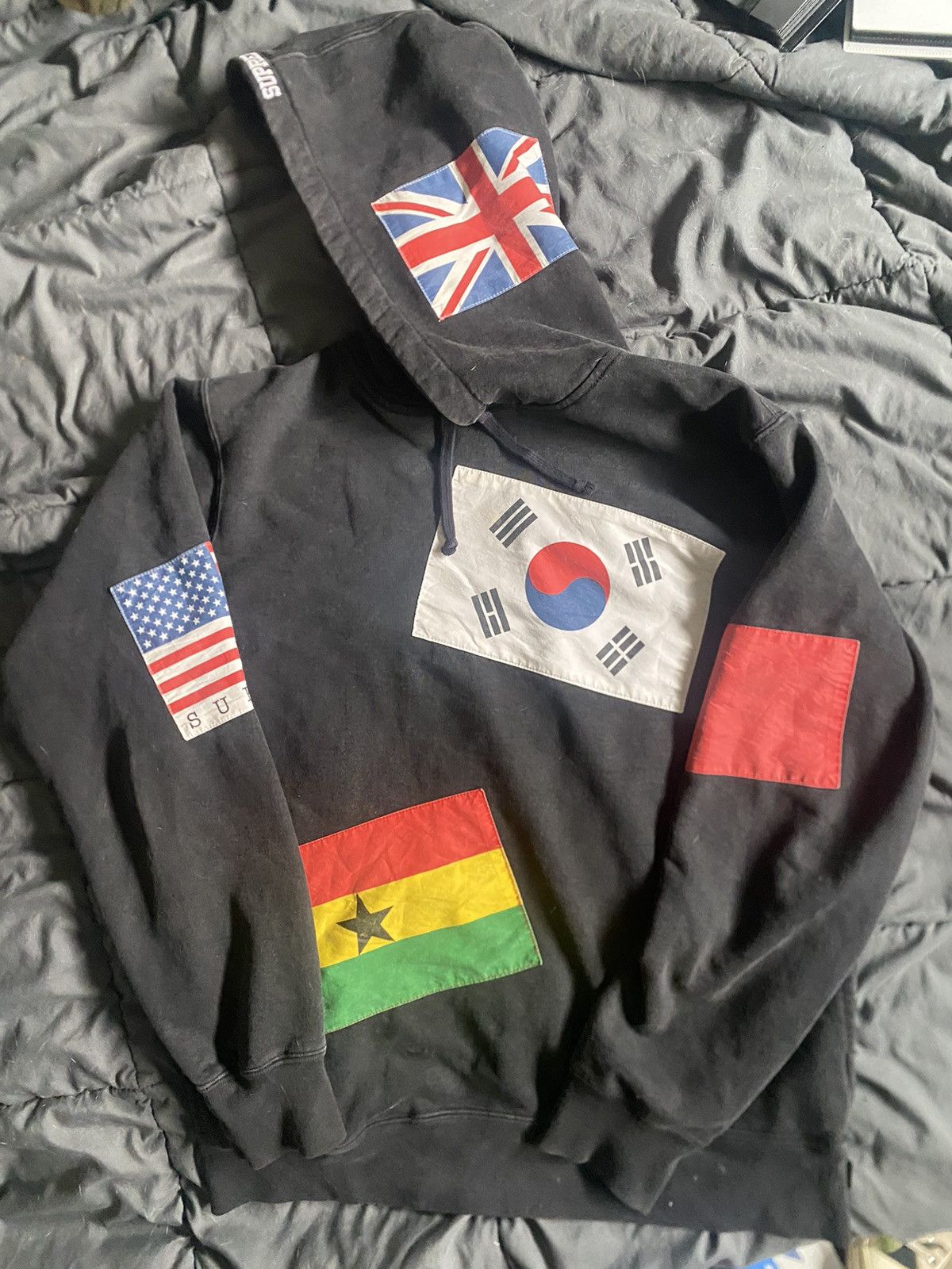 image of Supreme International Hoodie () in Black, Men's (Size Medium)