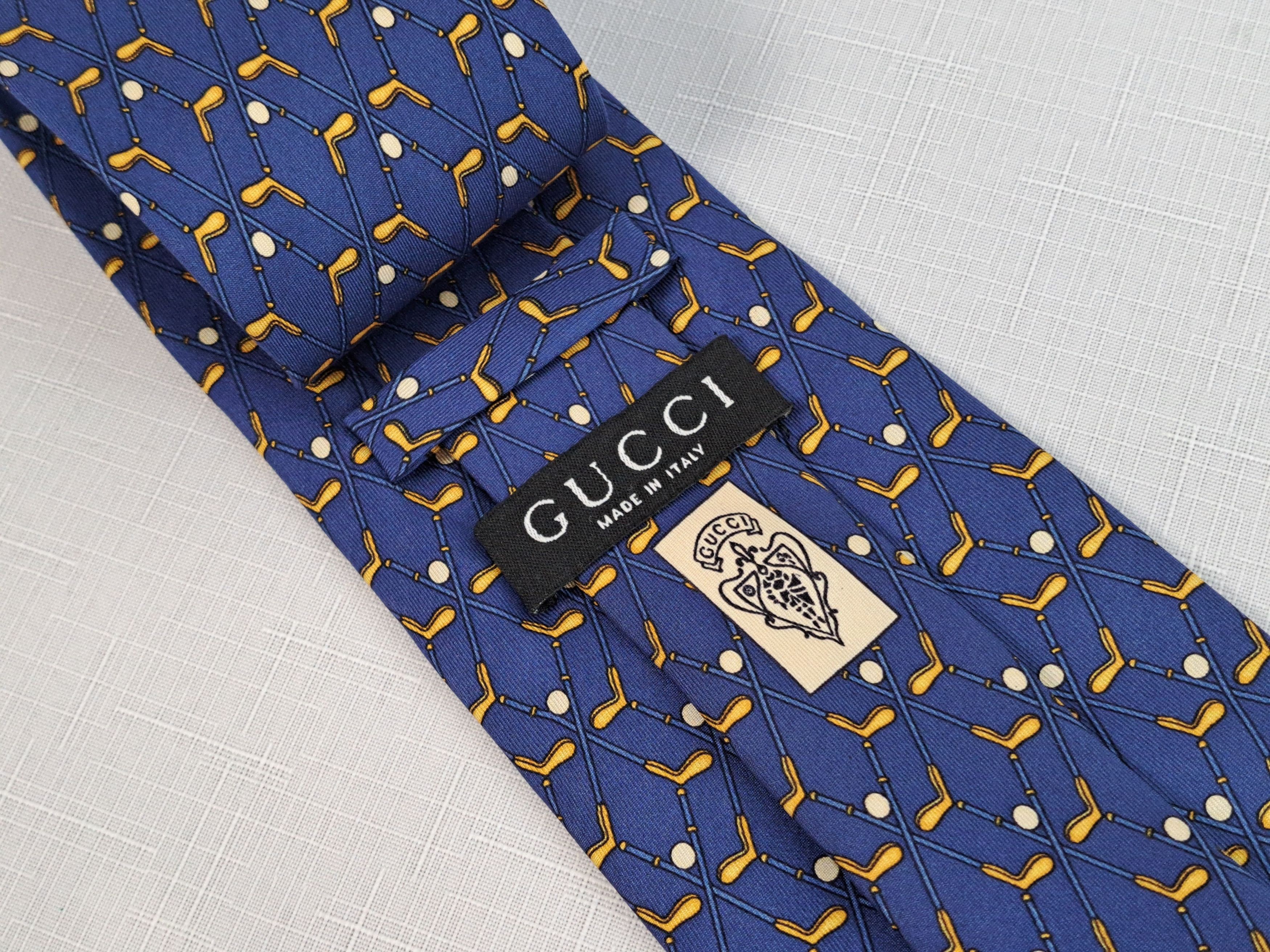 GUCCI golf motif silk tie. Made in Italy.