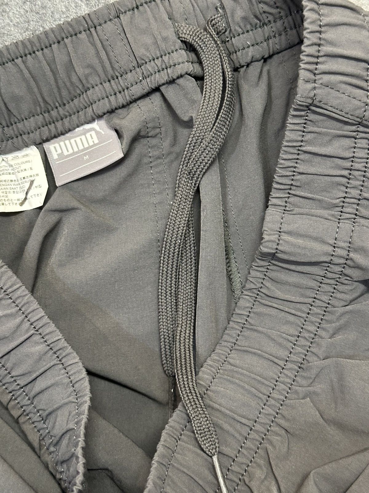 Puma PUMA dark grey track pants with a 3/4 length. Size US 30 / EU 46 - 10 Thumbnail