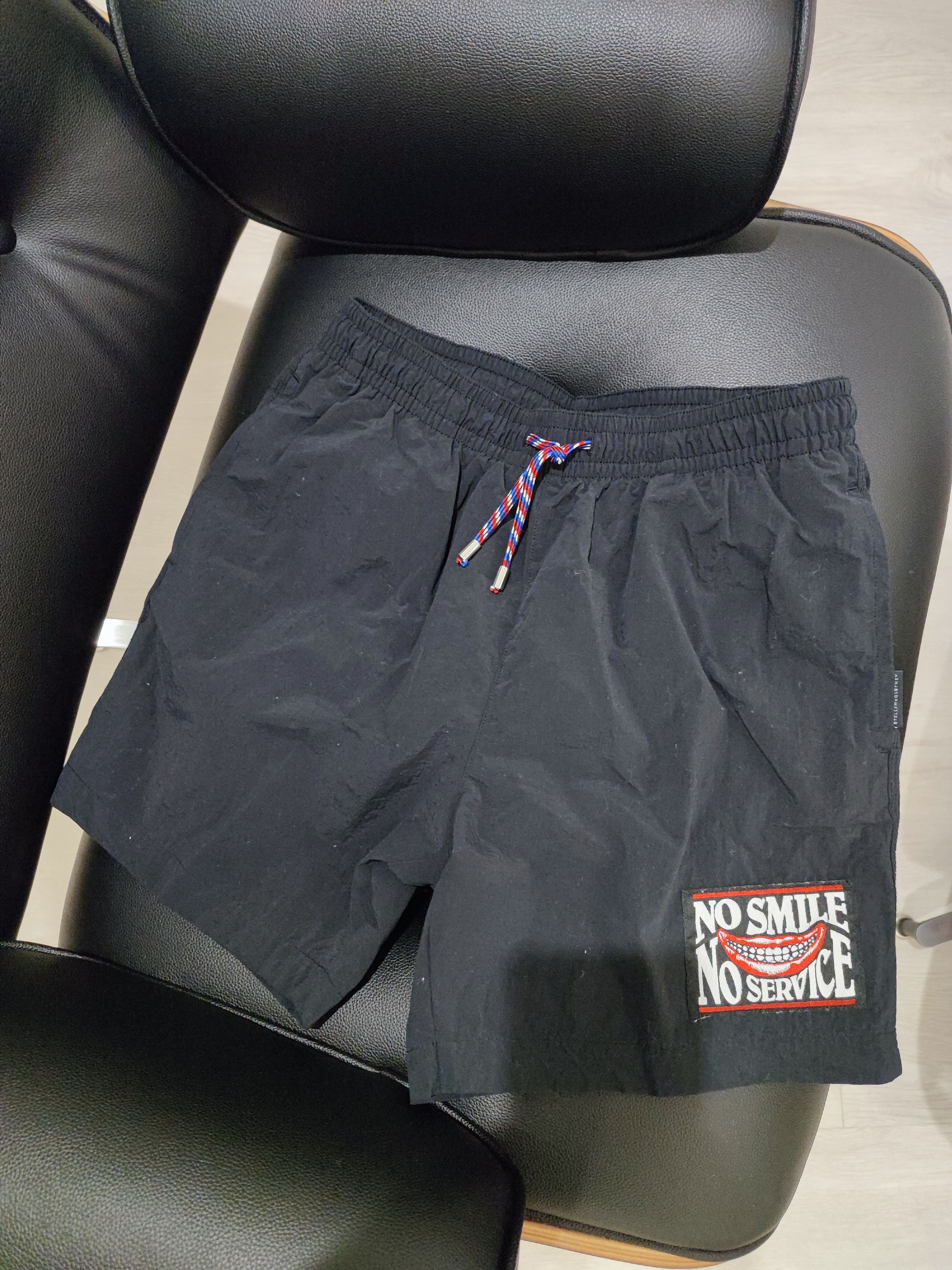no smile no servive swim shorts