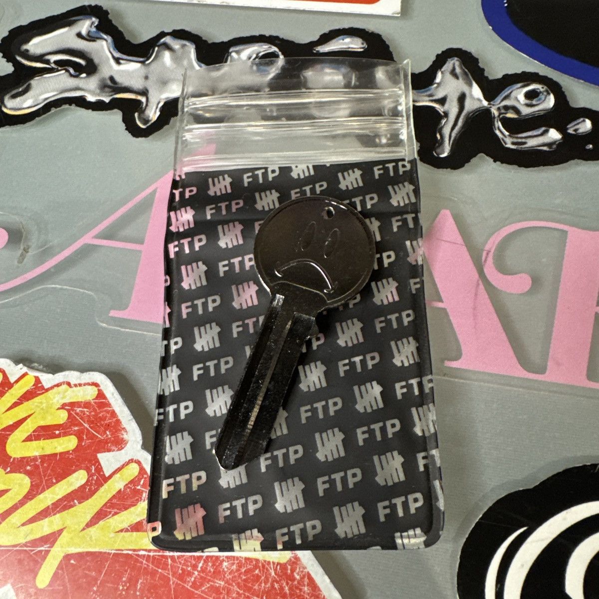 Fuck The Population FTP Undefeated Smiley Key Blank FUCKTHEPOPULATION New Size ONE SIZE - 2 Thumbnail