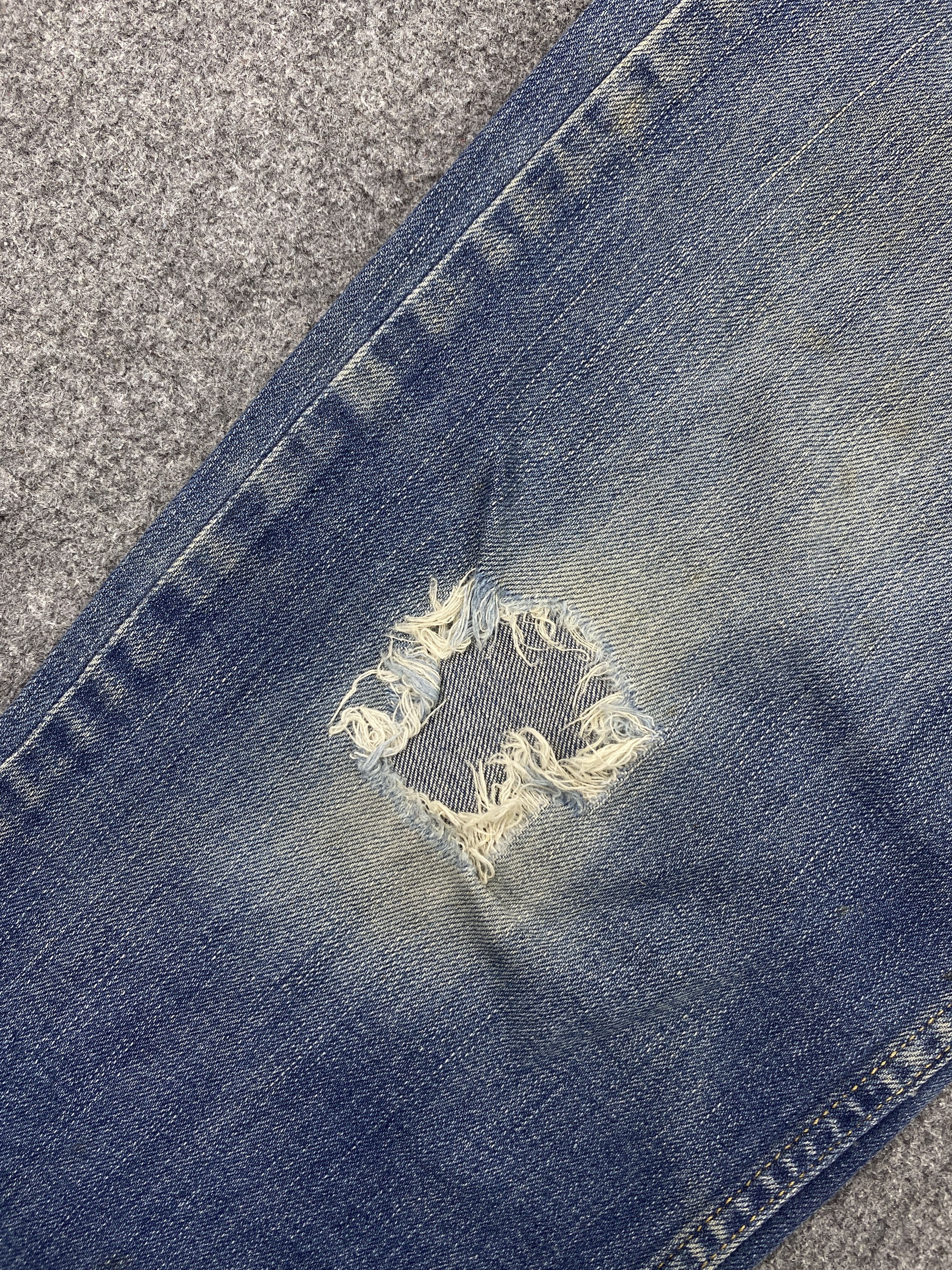 Distressed Vintage Levi's 514 Faded Blue Jeans