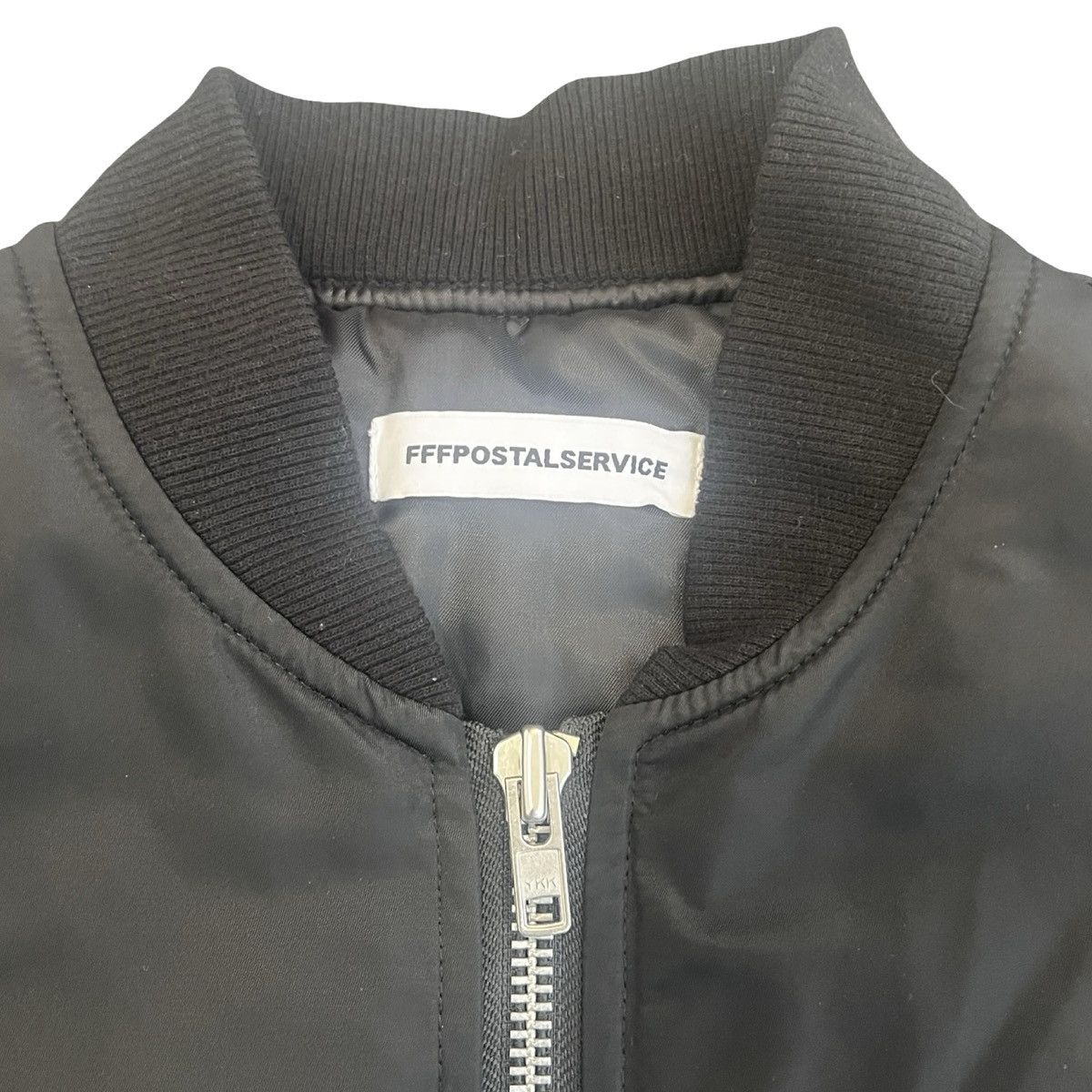 FFFPOSTALSERVICE FFF POSTAL SERVICE GRAPHIC MA-1 JACKET BLACK Size US S / EU 44-46 / 1 - 2 Thumbnail