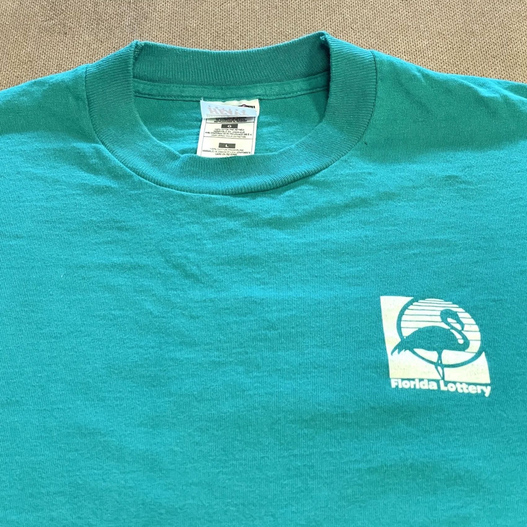 Fruit Of The Loom VINTAGE Florida Lottery Shirt Mens Large Teal Promo 90s Flamingo Graphic Print Crew Neck Short Sleeve Cotton 100% Fruit of the Loom HRG JamaicA Size US L / EU 52-54 / 3 - 2 Thumbnail
