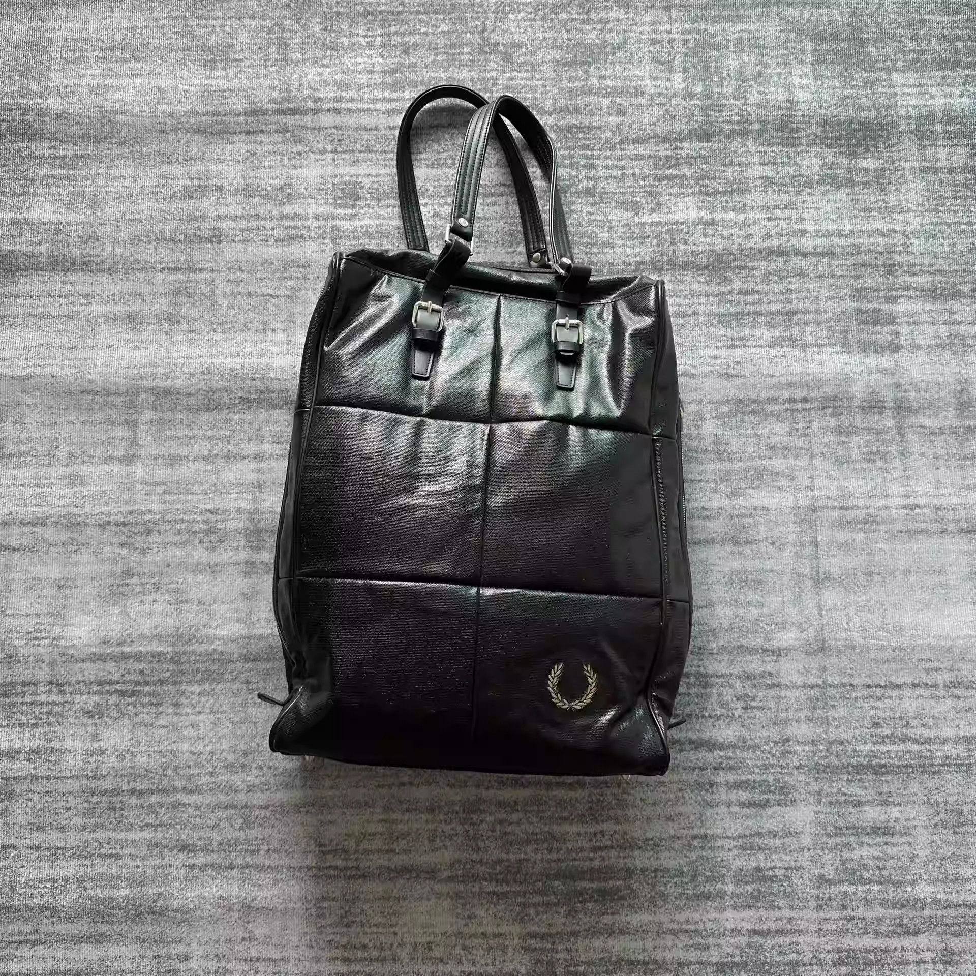raf simons fred perry co-branded leather travel bag