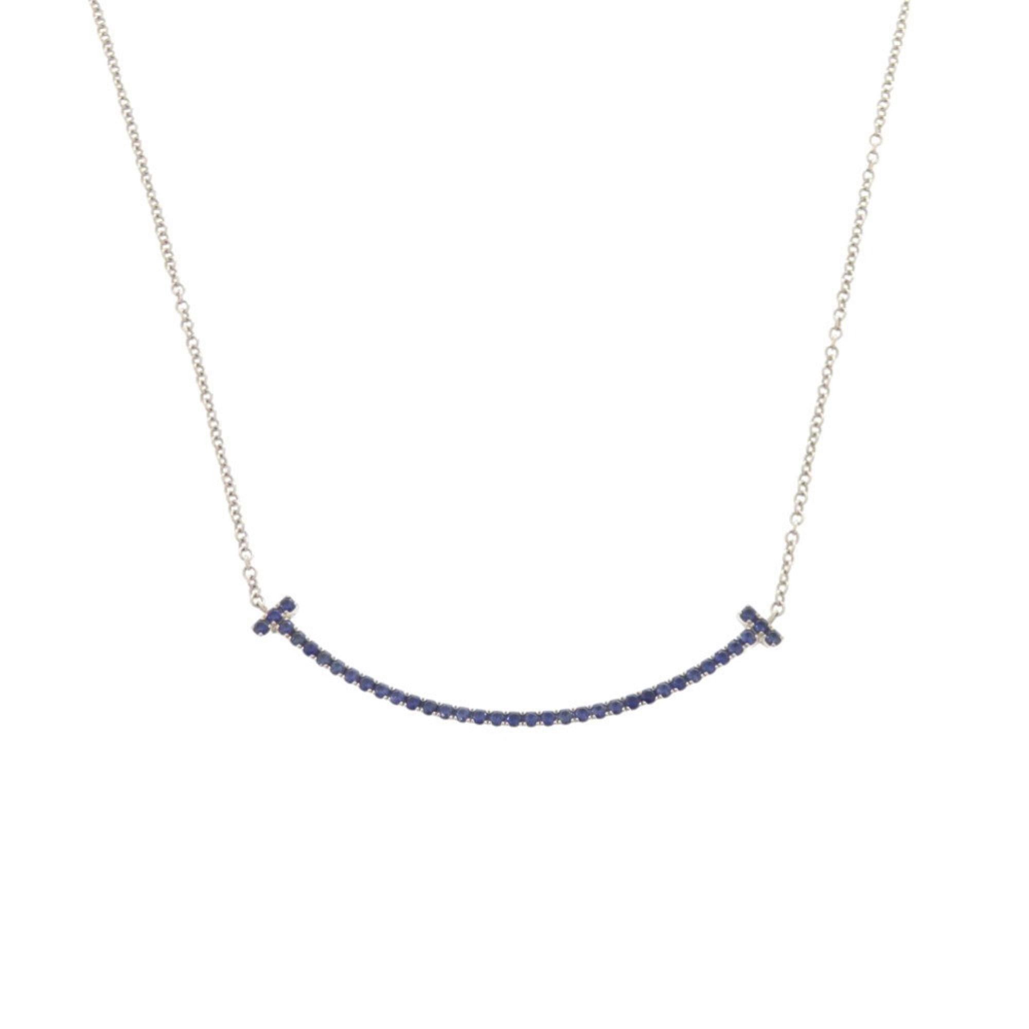 Tiffany & Co. Excellent condition Tiffany T Smile small necklace in 18K white gold with sapphire and 750 gold. Item number 1416. Size ONE SIZE - 1 Thumbnail