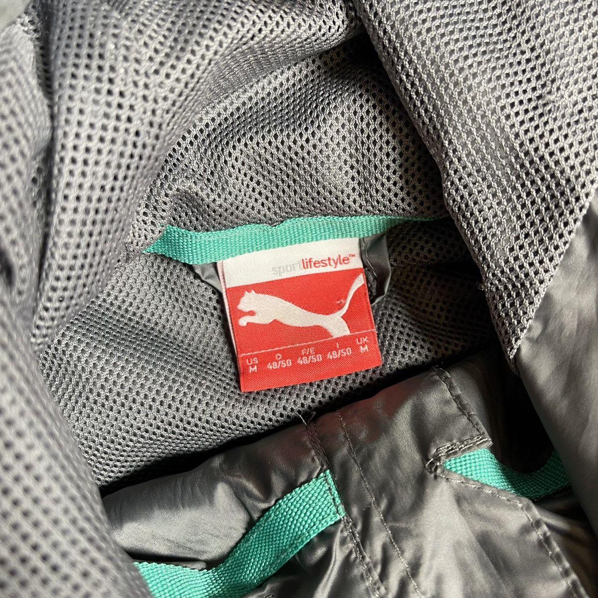 Formula 1 × Mercedes-Benz × Puma MERCEDES BENZ PUMA 2014 F1 PETRONAS AMG MESH LINES JACKET Size US M / EU 48-50 / 2 - 6 Thumbnail