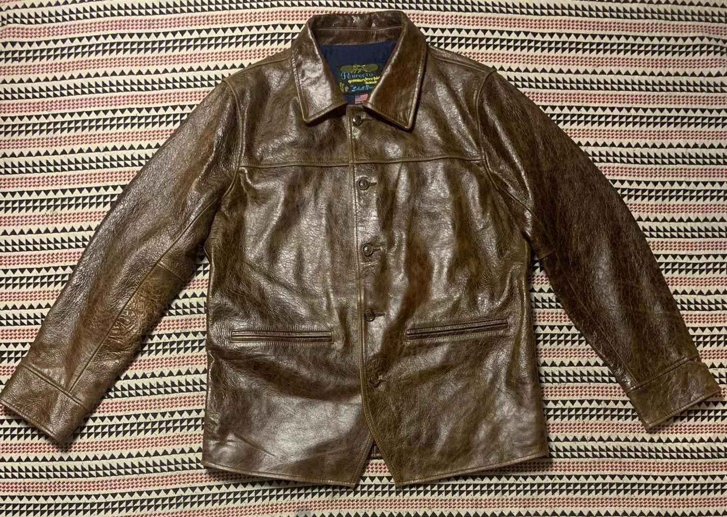 brown leather jacket by Schott