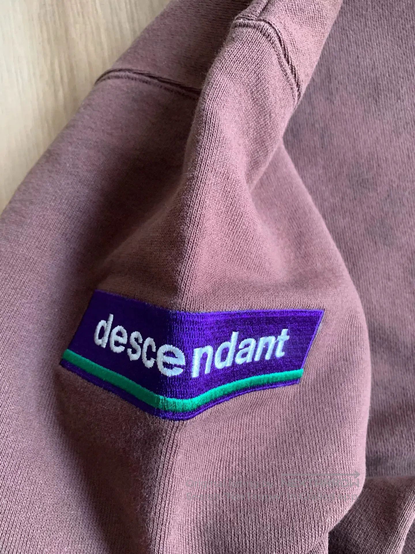 descendant crew neck sweatshirt with embroidery.