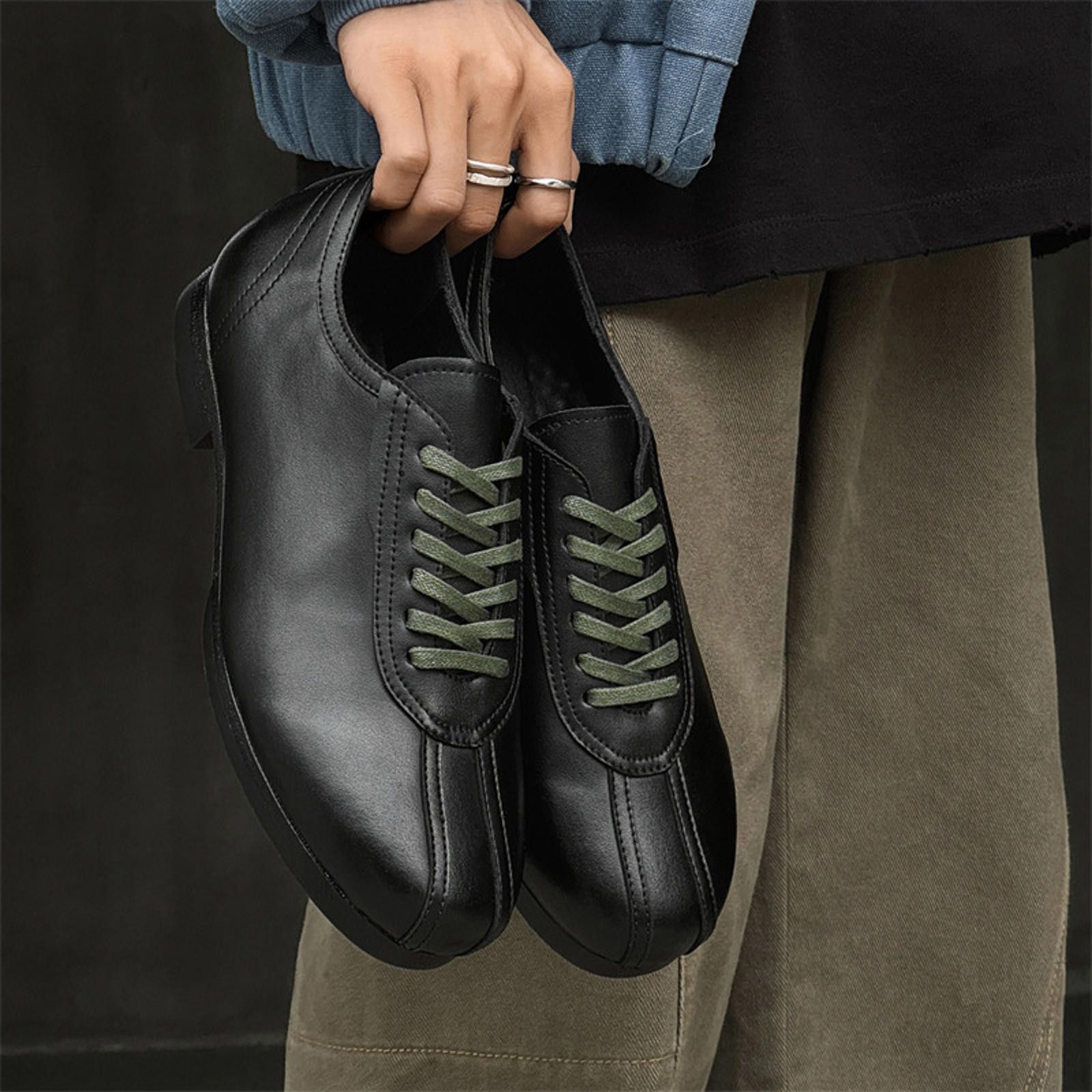 Stylish Black Leather Sneakers with Green Laces