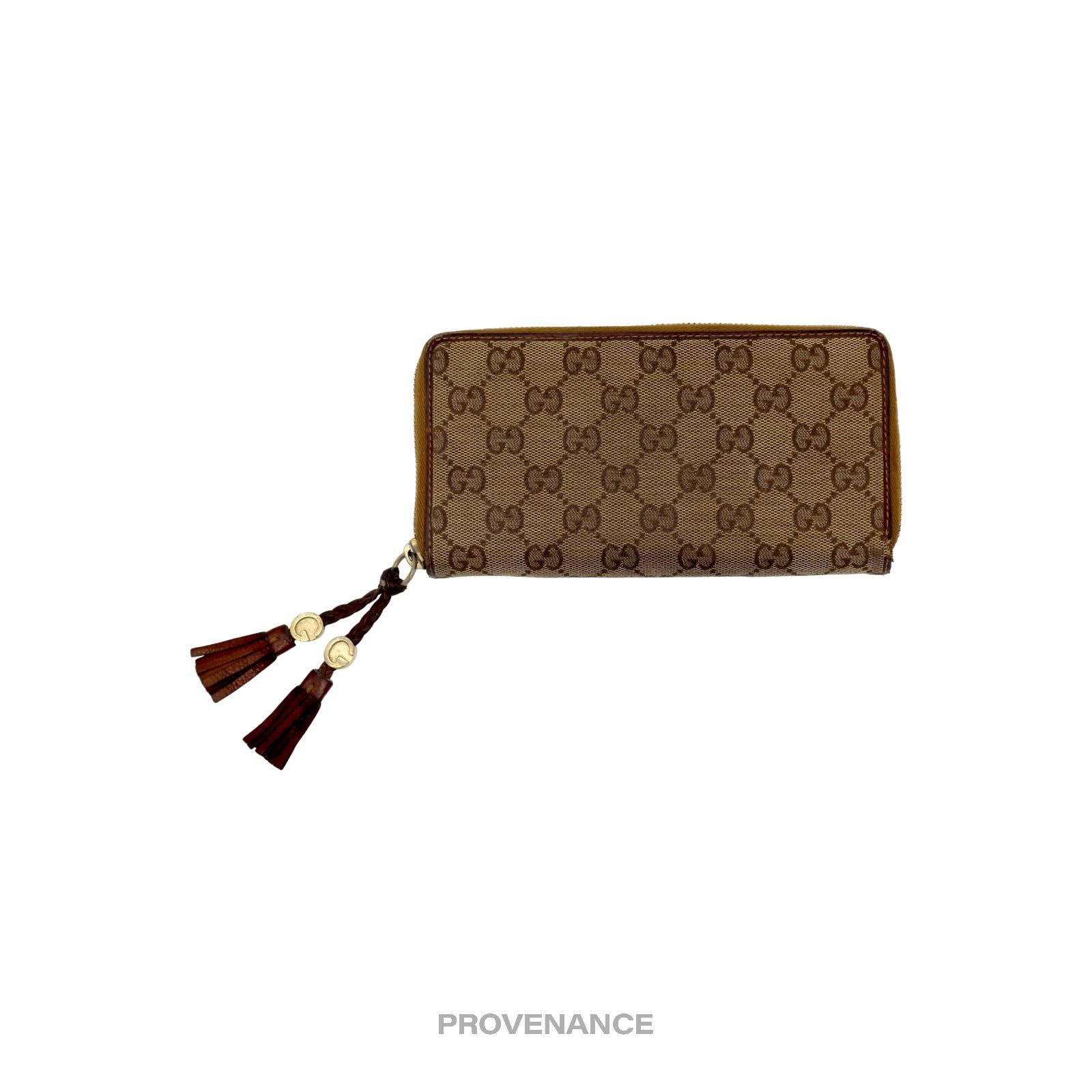 image of Gucci Long Wallet - GG Canvas With Tassels in Brown, Women's