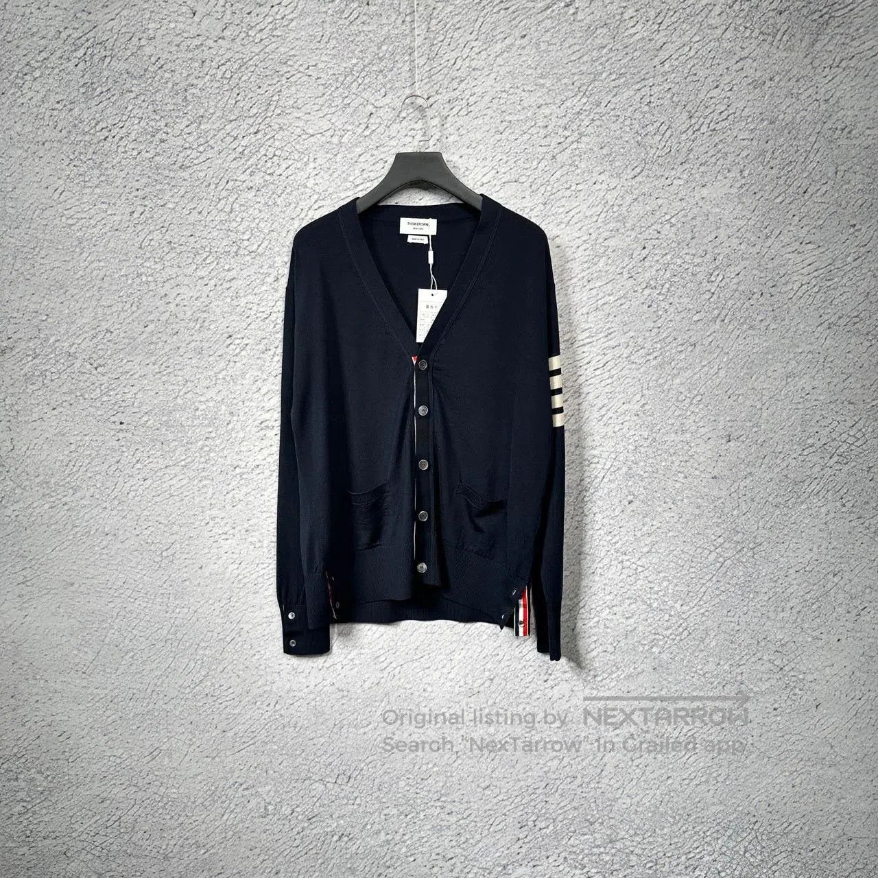 thom browne navy classic cardigan with stripes.