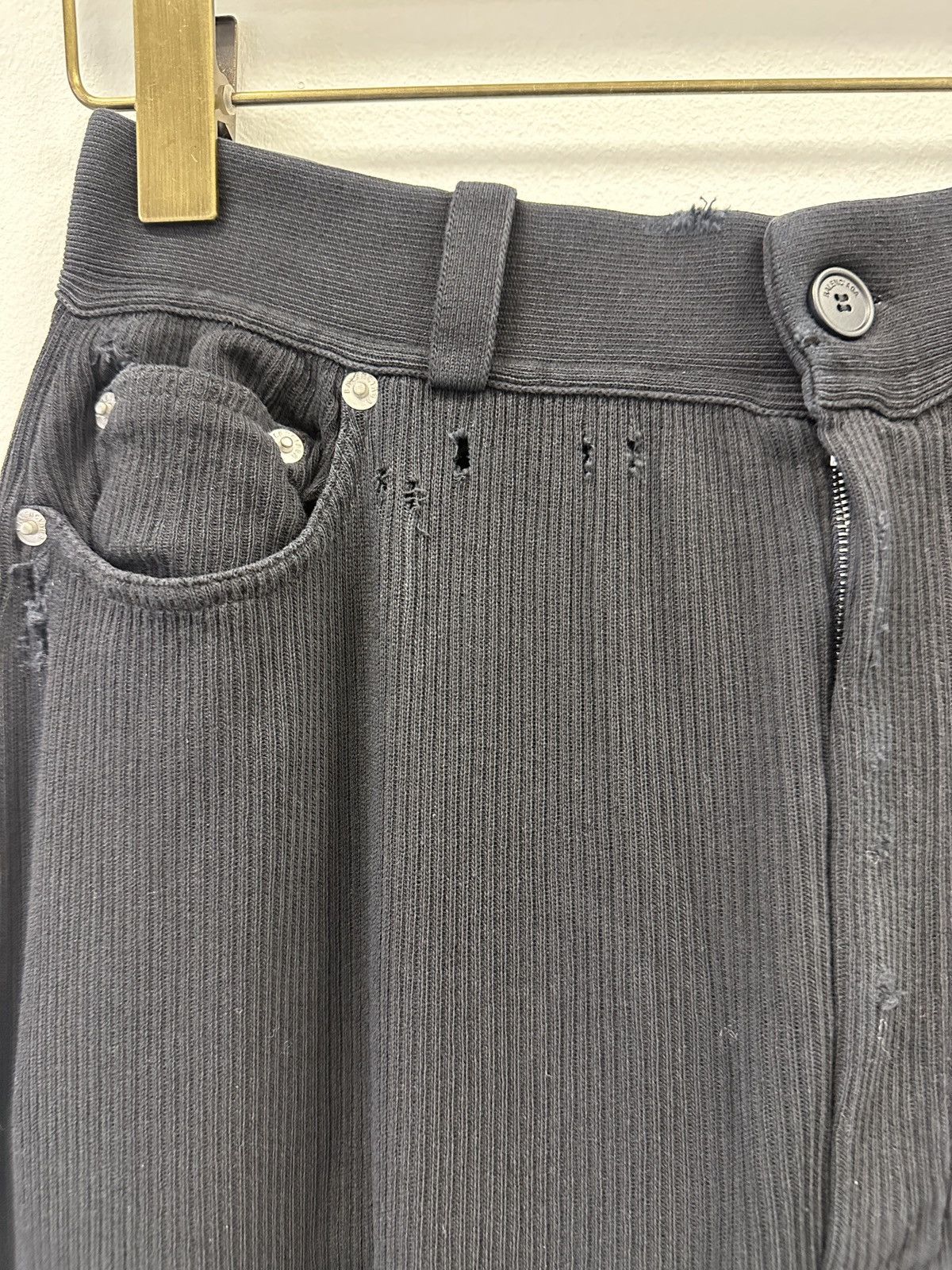 Distressed-effect trousers